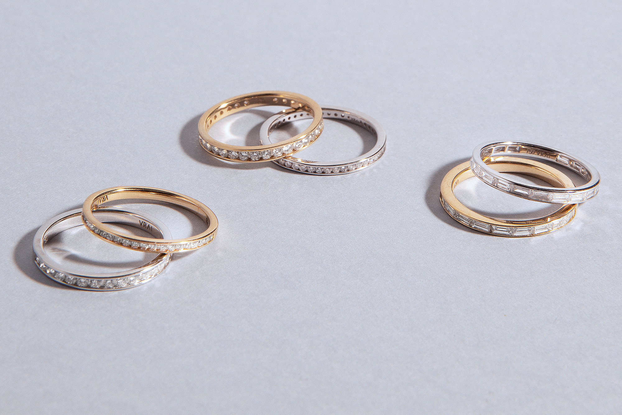 three sets of promise rings in gold and silver