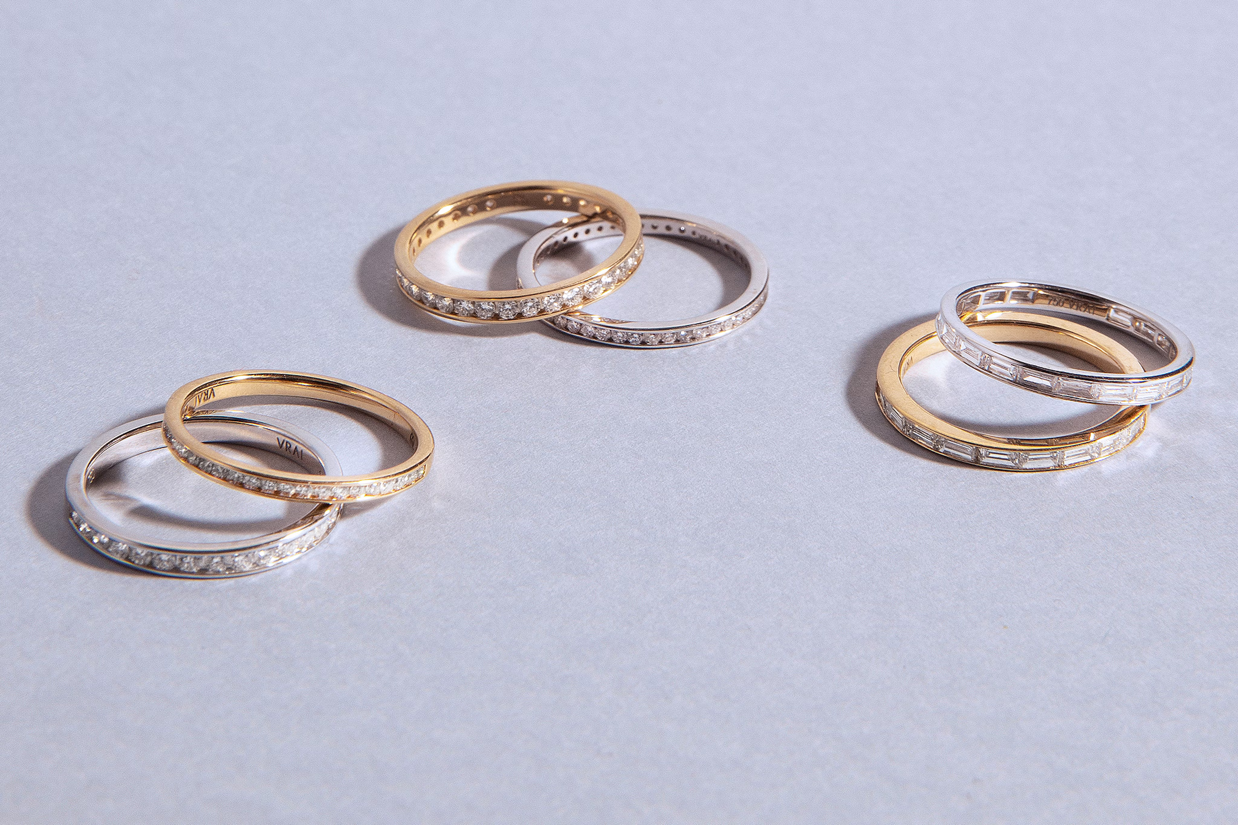 three sets of promise rings in gold and silver