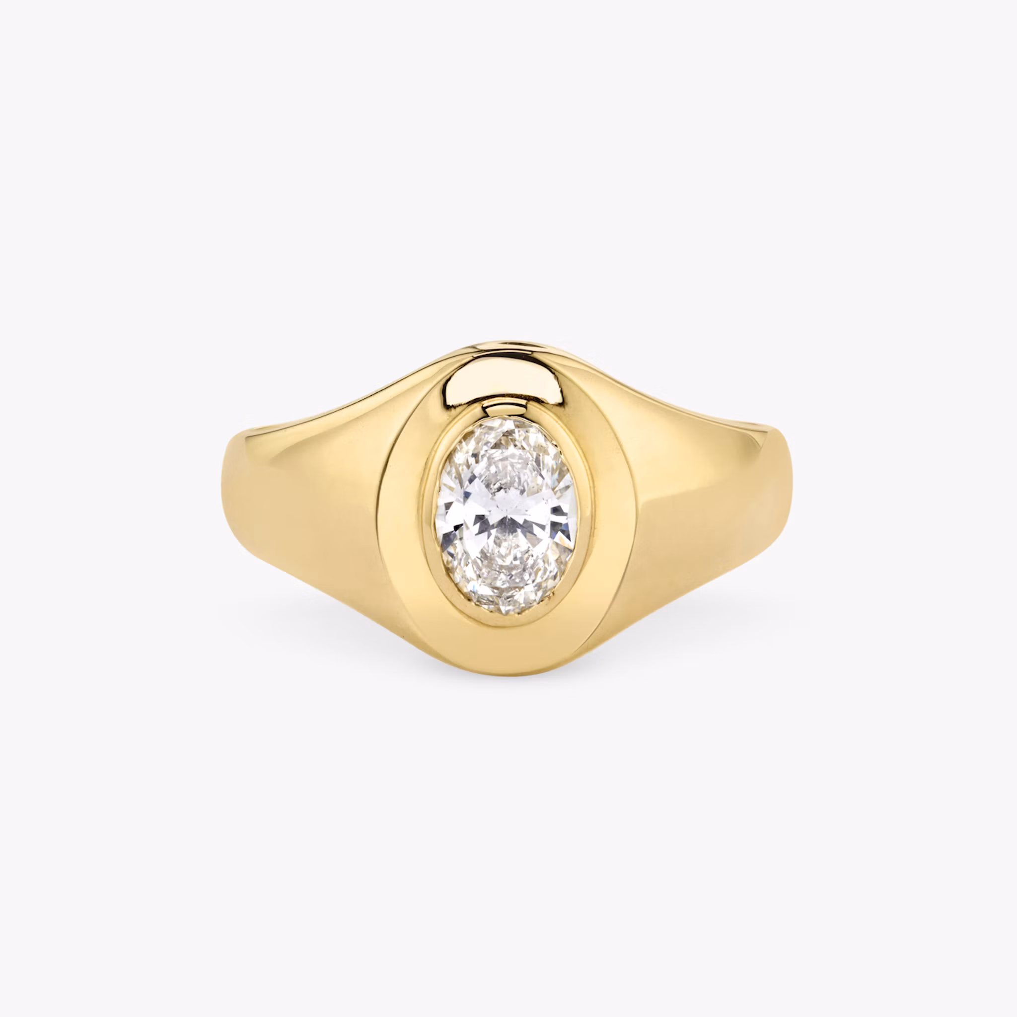 Front view of an oval signet ring in oval yellow gold on a white background