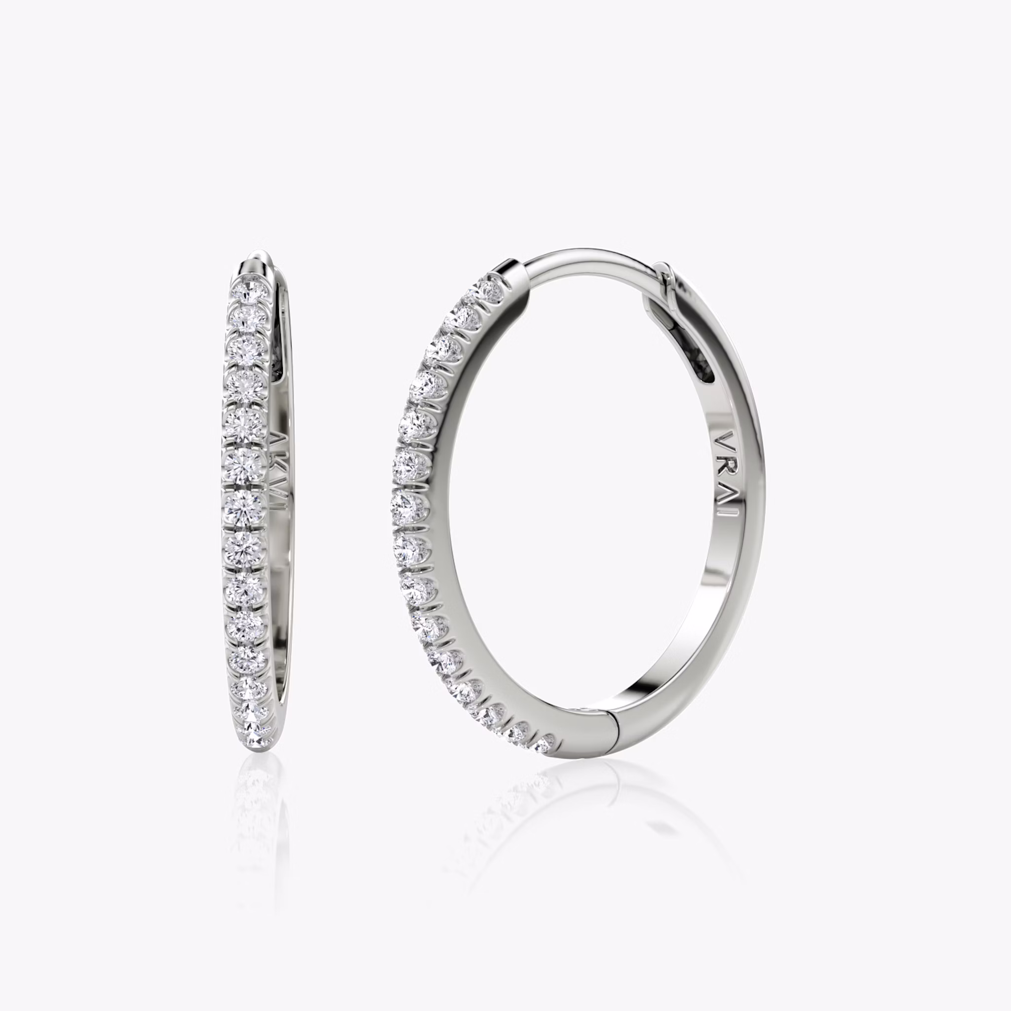 A pair of sterling silver or white gold Pavé Hoops.