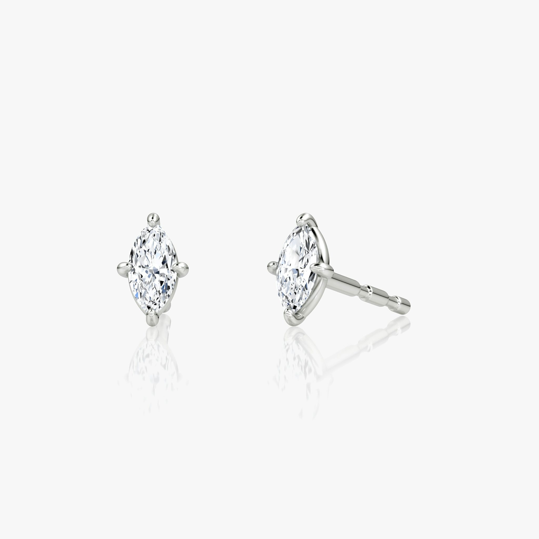A pair of Petite Solitaire Studs in sterling silver or white gold.
