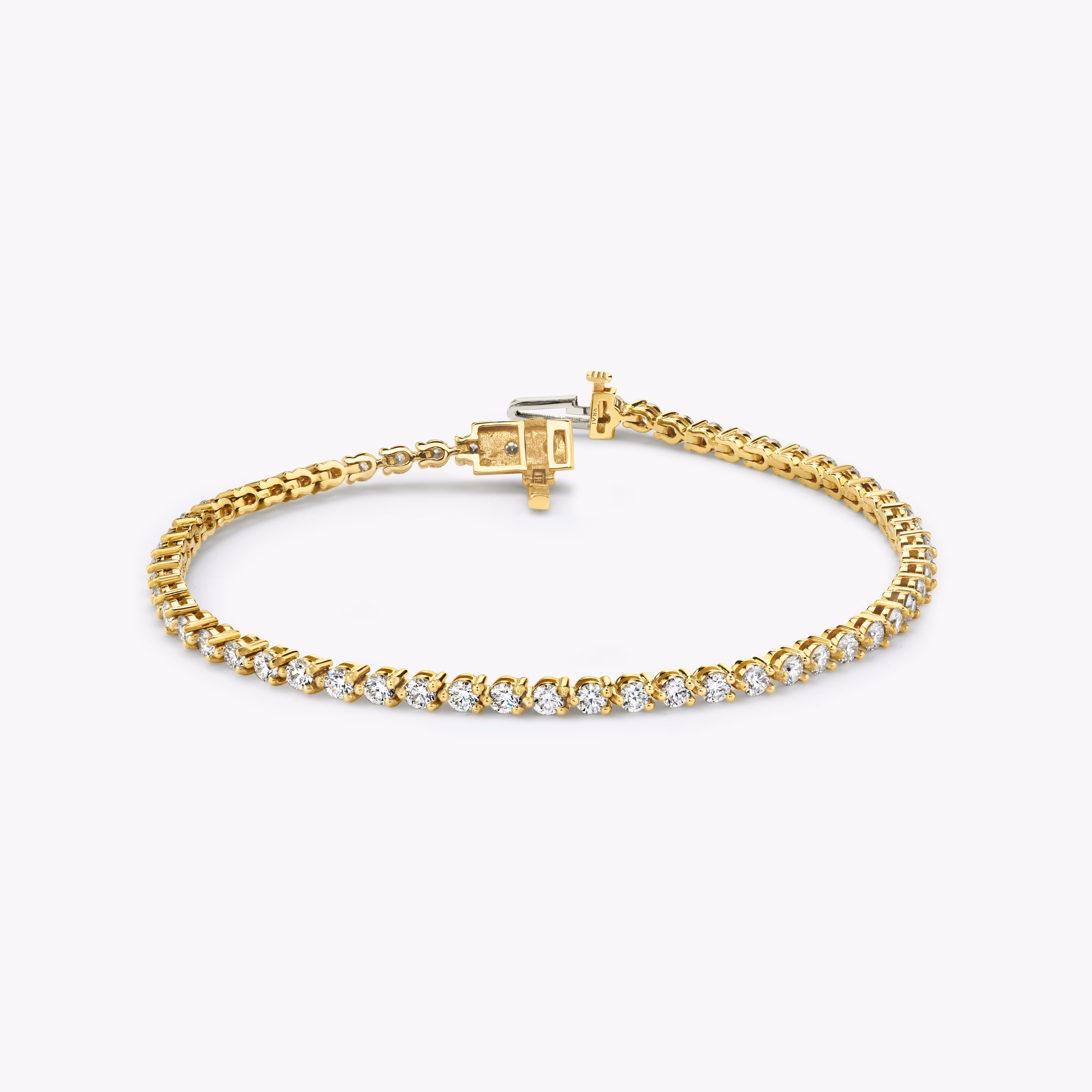 6. Petite Yellow Gold Round Tennis Bracelet
