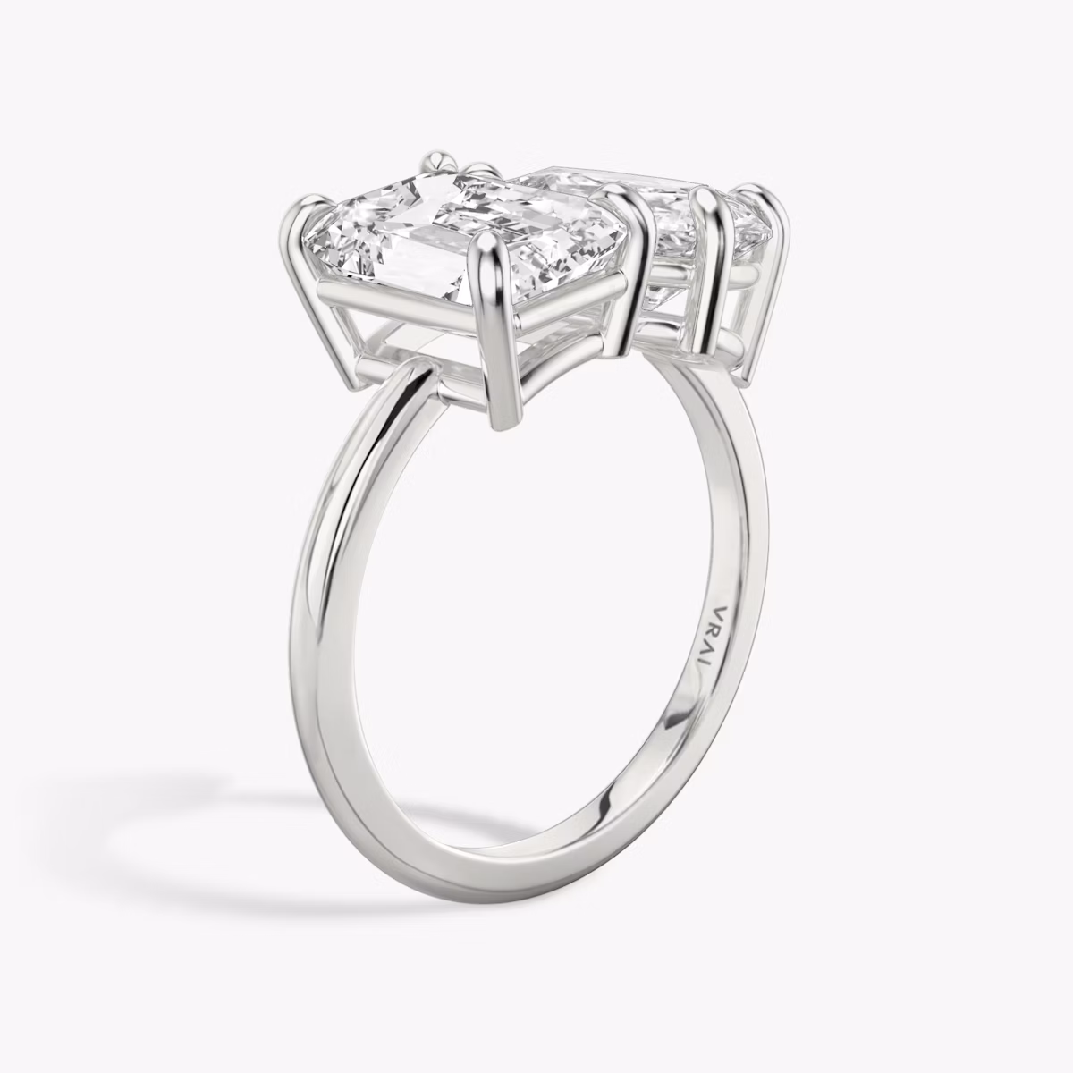 The Toi et Moi | Emerald and Pear | Platinum | bandAccent: Plain | diamondOrientation: vertical | caratWeight: other