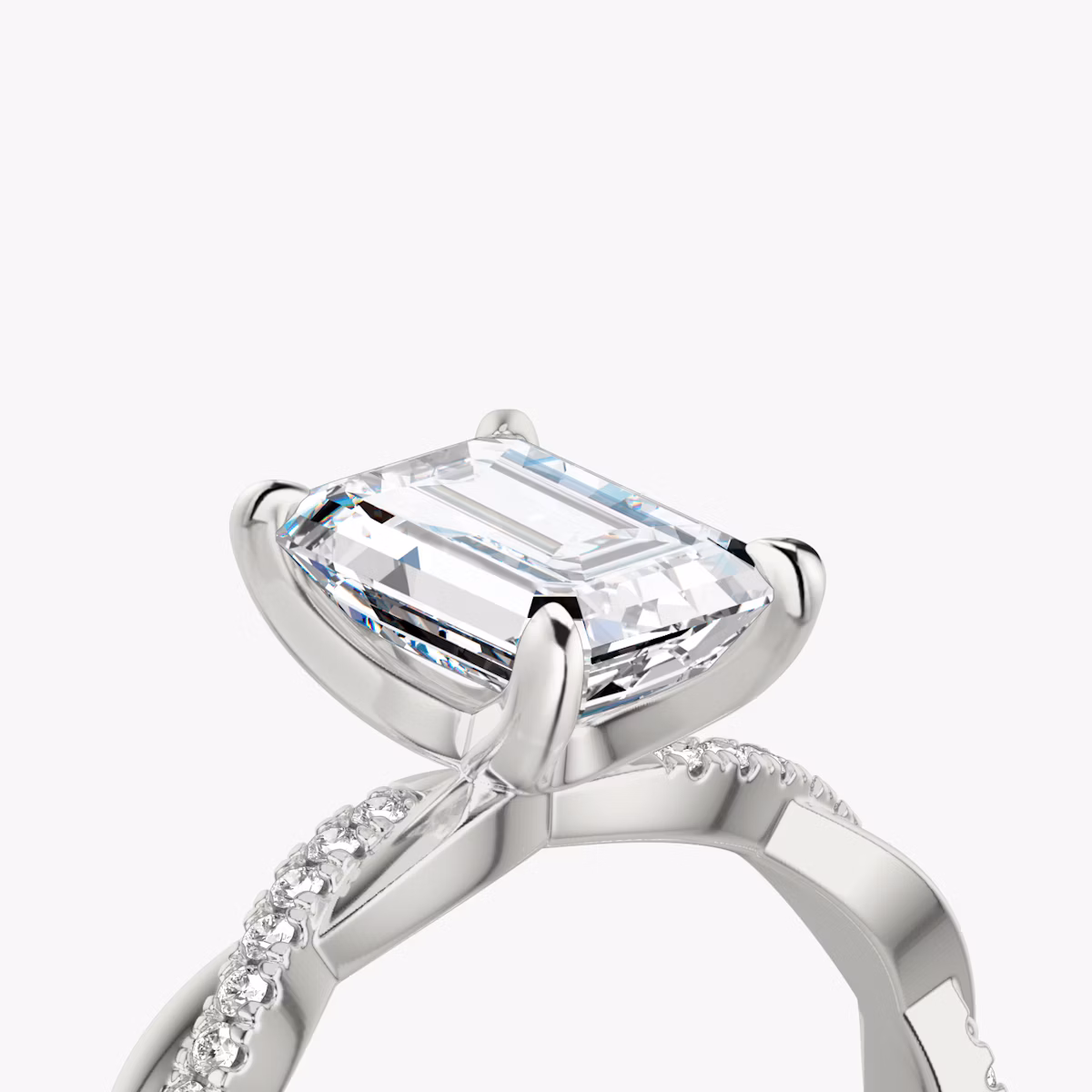 The Twisted Classic | Emerald | Platinum | bandAccent: Pavé | diamondOrientation: vertical | caratWeight: other