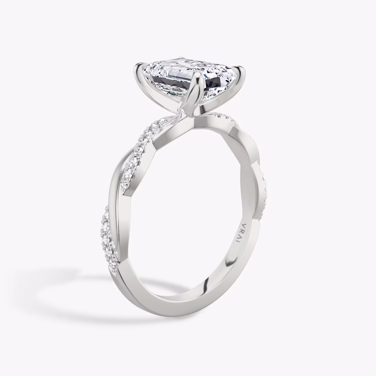 The Twisted Classic | Emerald | Platinum | bandAccent: Pavé | diamondOrientation: vertical | caratWeight: other