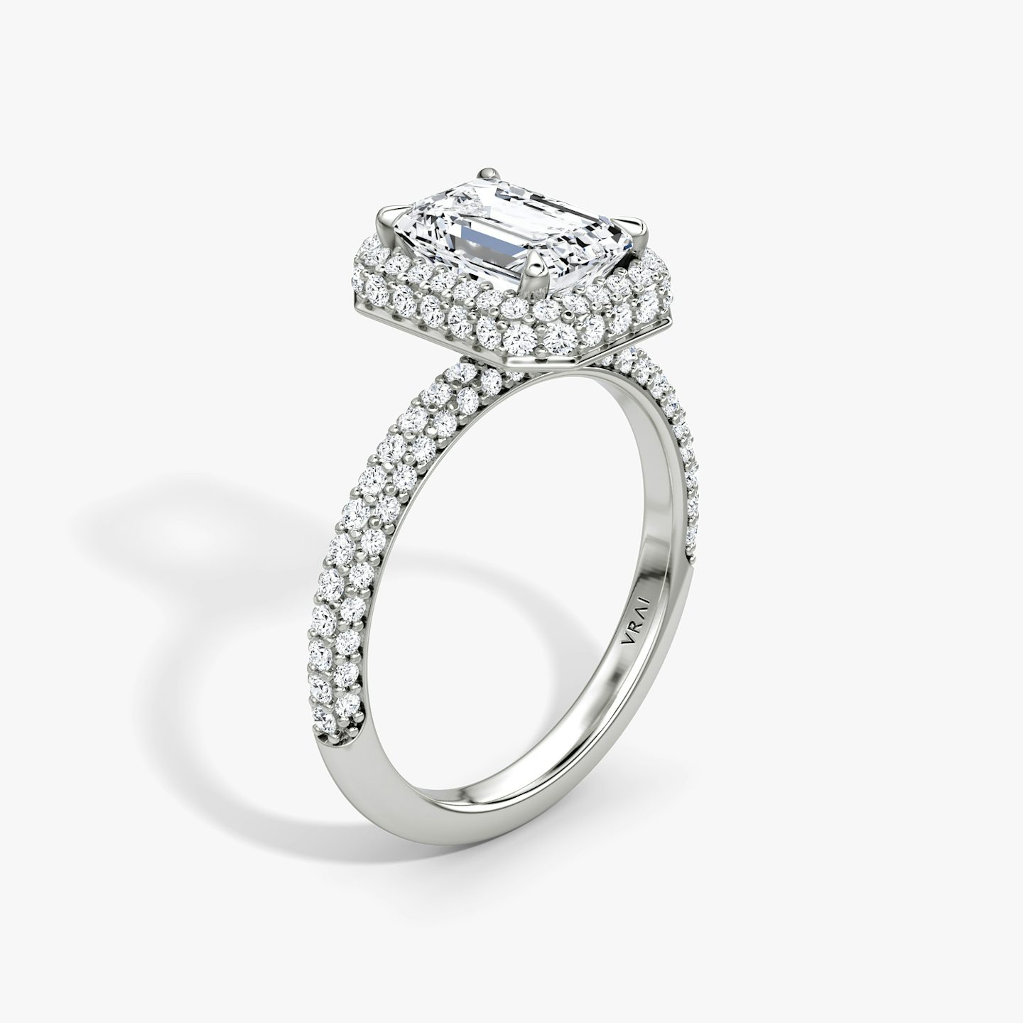 The Halo Dome | Emerald | Platinum | bandAccent: Pavé | diamondOrientation: vertical | caratWeight: other