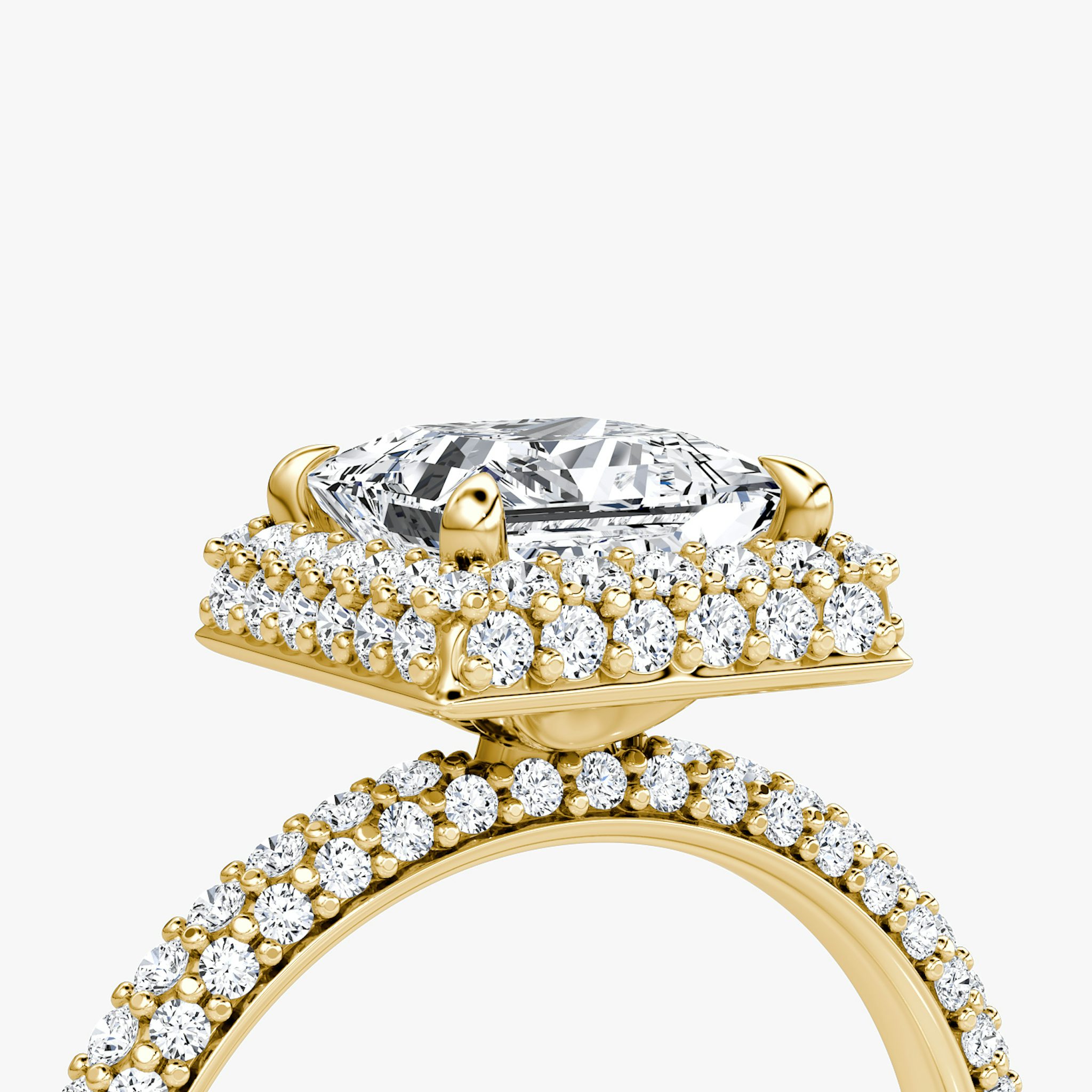 detail of three-row dome halo engagement ring princess cut in pave yellow gold