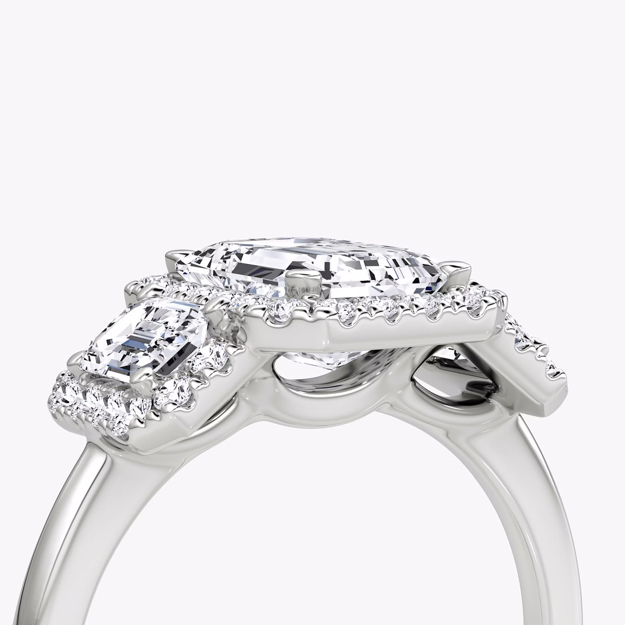 The Three Stone Halo | Emerald | 18k | White Gold | bandAccent: Plain | sideStoneCarat: 0.25ct | diamondOrientation: vertical | caratWeight: other