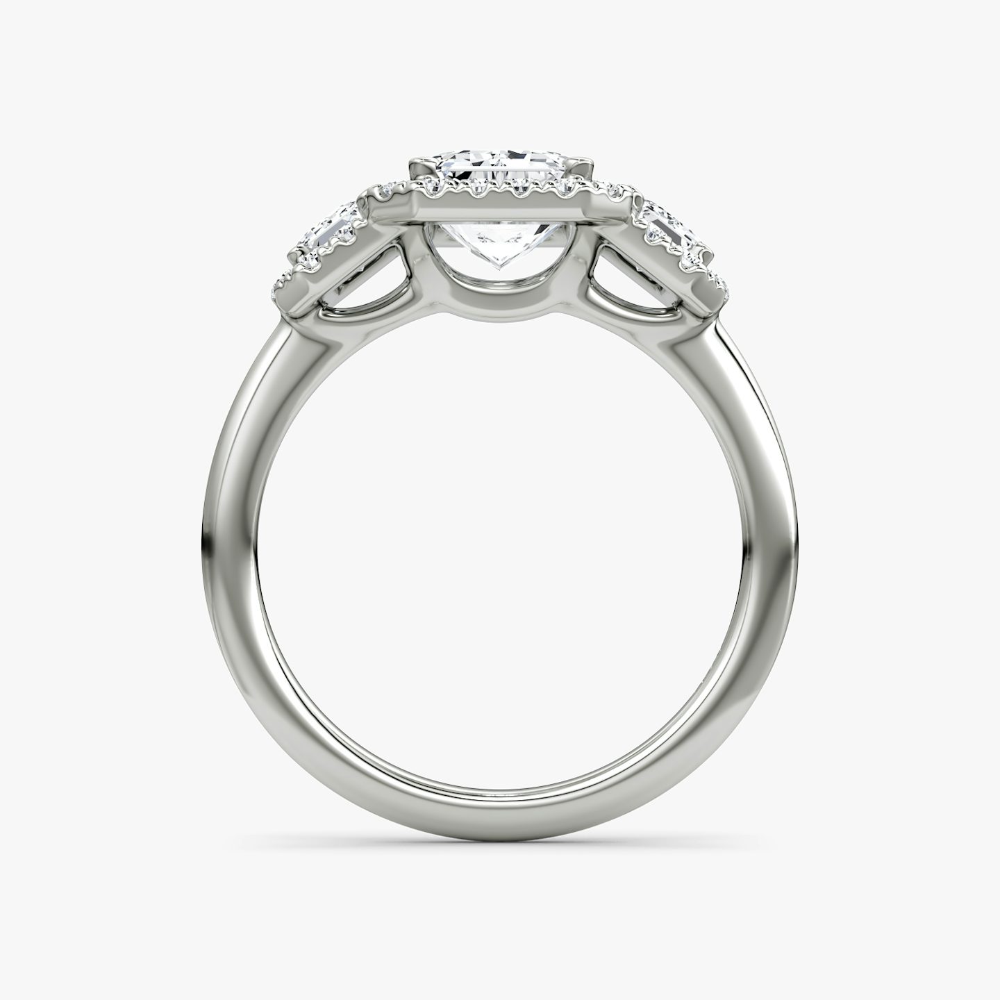 The Three Stone Halo | Emerald | Platinum | bandAccent: Plain | sideStoneCarat: 0.25ct | diamondOrientation: vertical | caratWeight: other