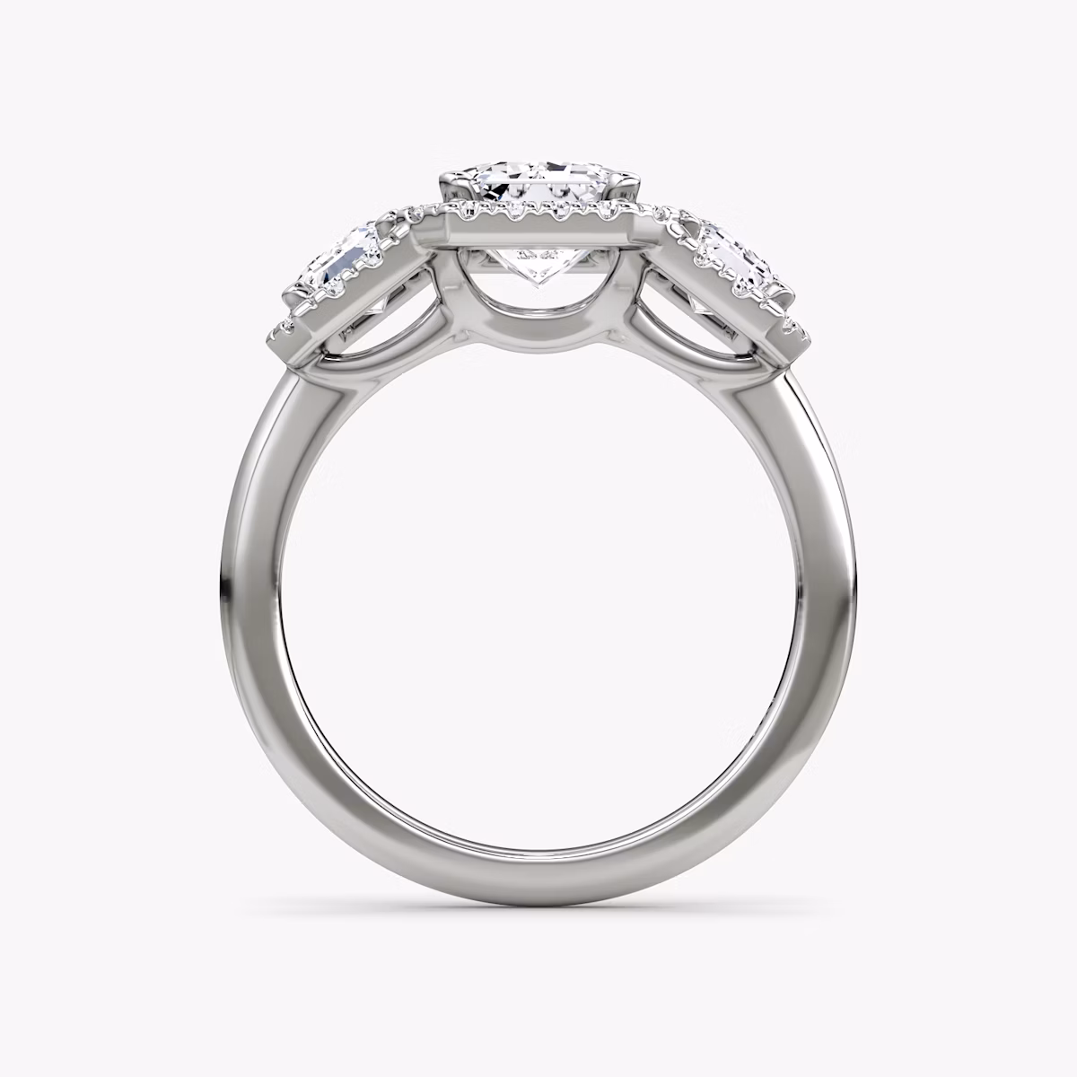 The Three Stone Halo | Emerald | Platinum | bandAccent: Plain | sideStoneCarat: 0.50ct | diamondOrientation: vertical | caratWeight: other