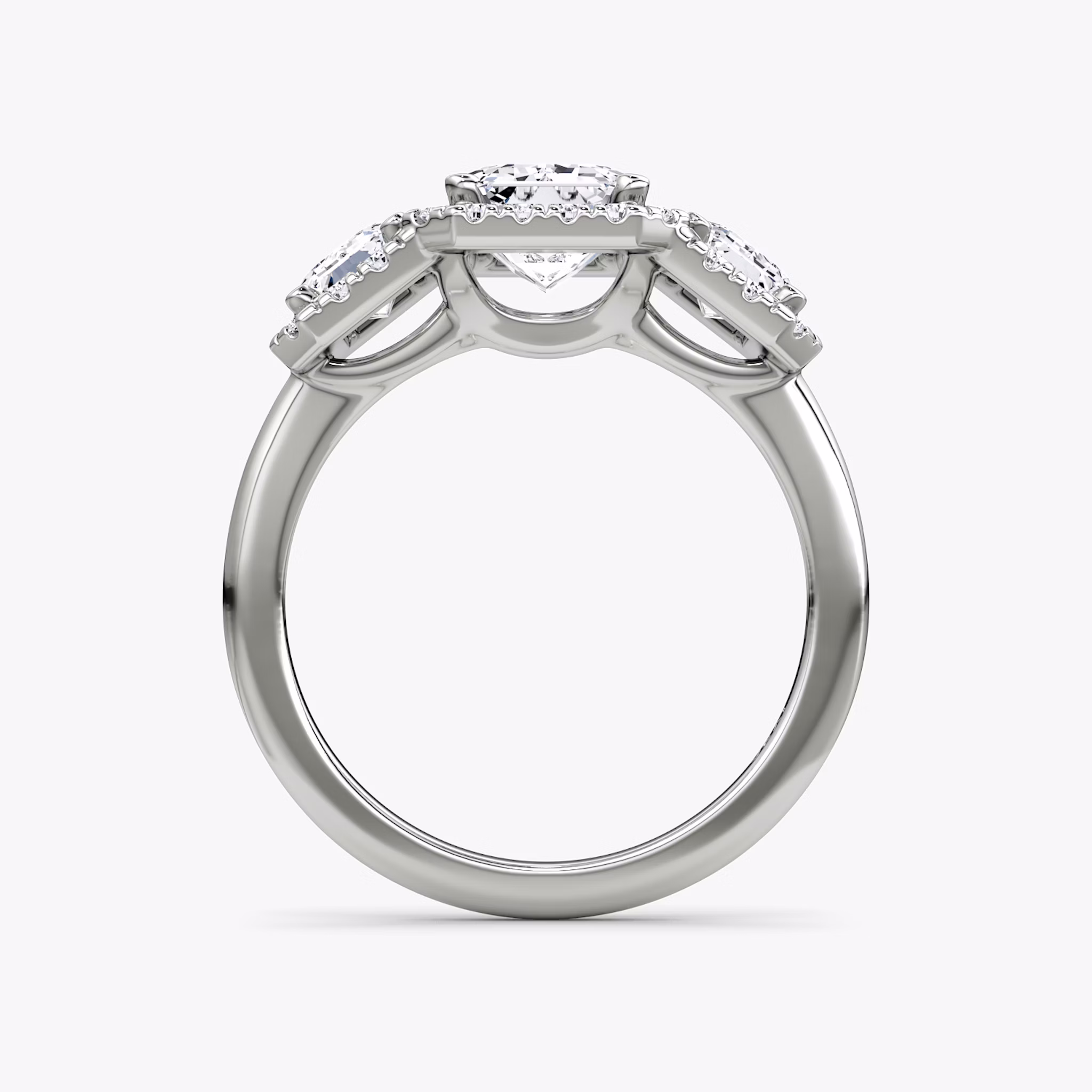 The Three Stone Halo | Emerald | Platinum | bandAccent: Plain | sideStoneCarat: 0.50ct | diamondOrientation: vertical | caratWeight: other