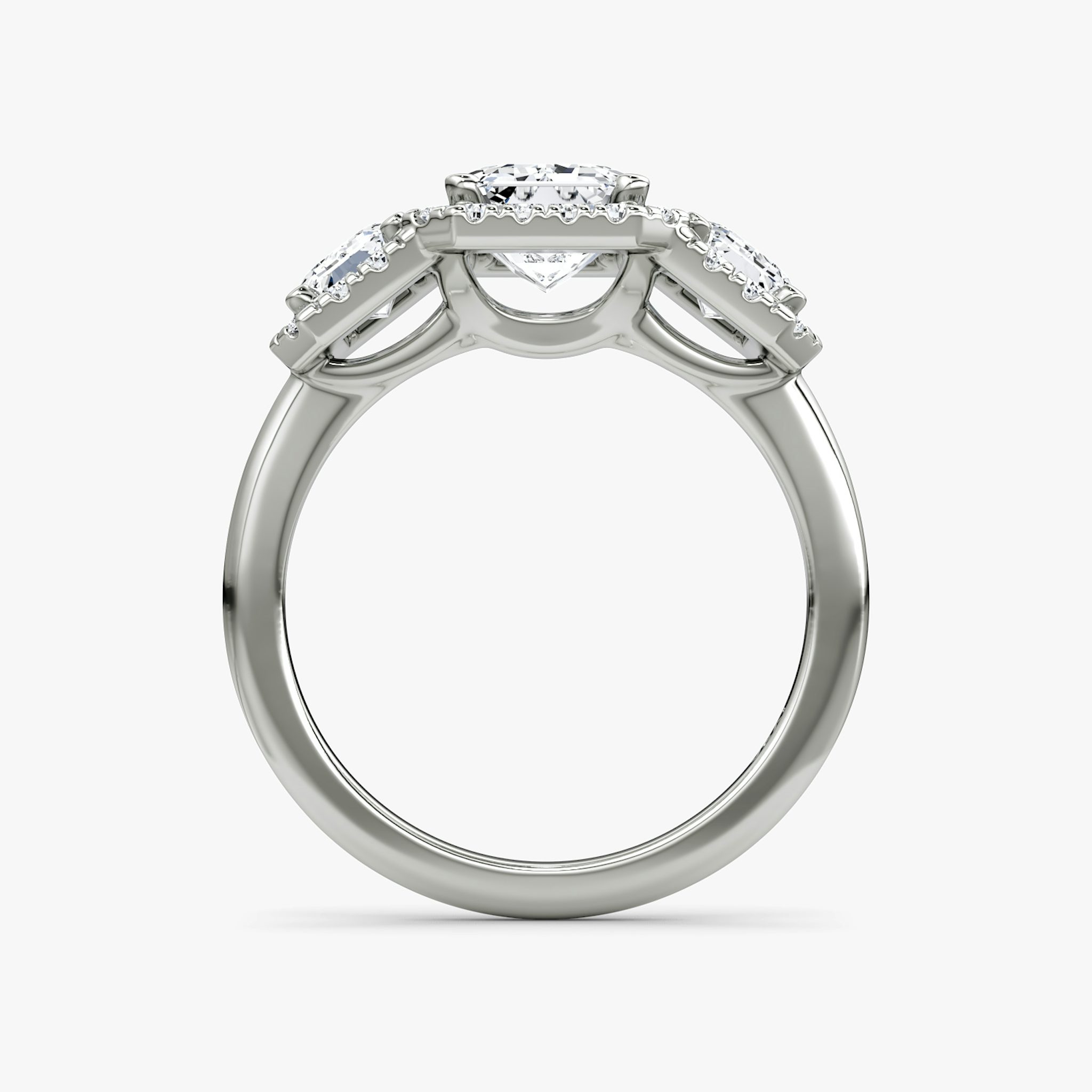 The Three Stone Halo | Emerald | Platinum | bandAccent: Plain | sideStoneCarat: 0.50ct | diamondOrientation: vertical | caratWeight: other