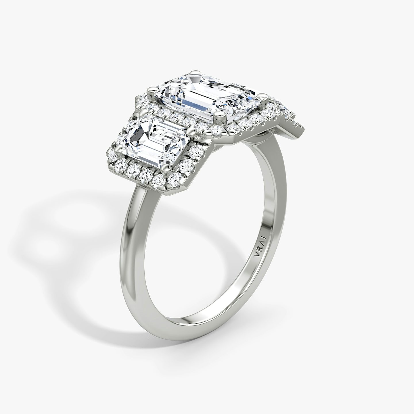 The Three Stone Halo | Emerald | 18k | White Gold | bandAccent: Plain | sideStoneCarat: 0.50ct | diamondOrientation: vertical | caratWeight: other