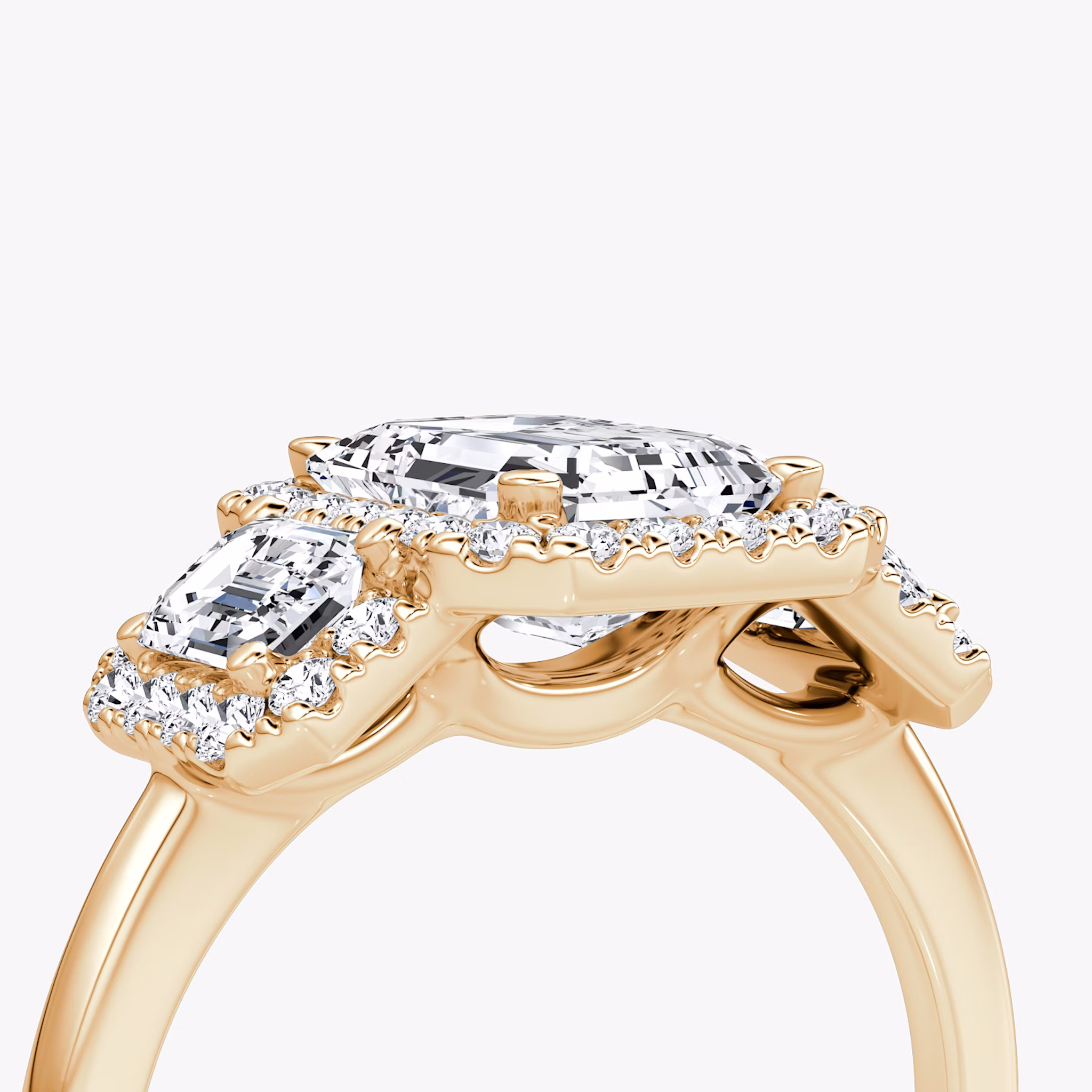 The Three Stone Halo | Emerald | 14k | Rose Gold | bandAccent: Plain | sideStoneCarat: 0.25ct | diamondOrientation: vertical | caratWeight: other