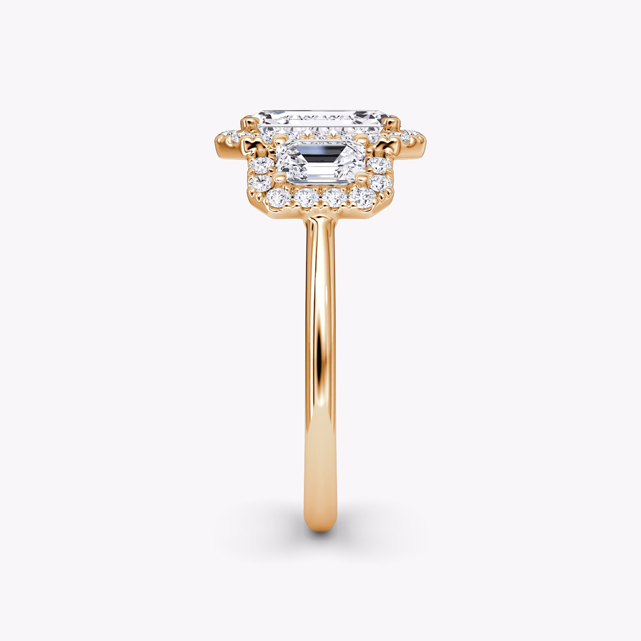 The Three Stone Halo | Emerald | 14k | Rose Gold | bandAccent: Plain | sideStoneCarat: 0.25ct | diamondOrientation: vertical | caratWeight: other