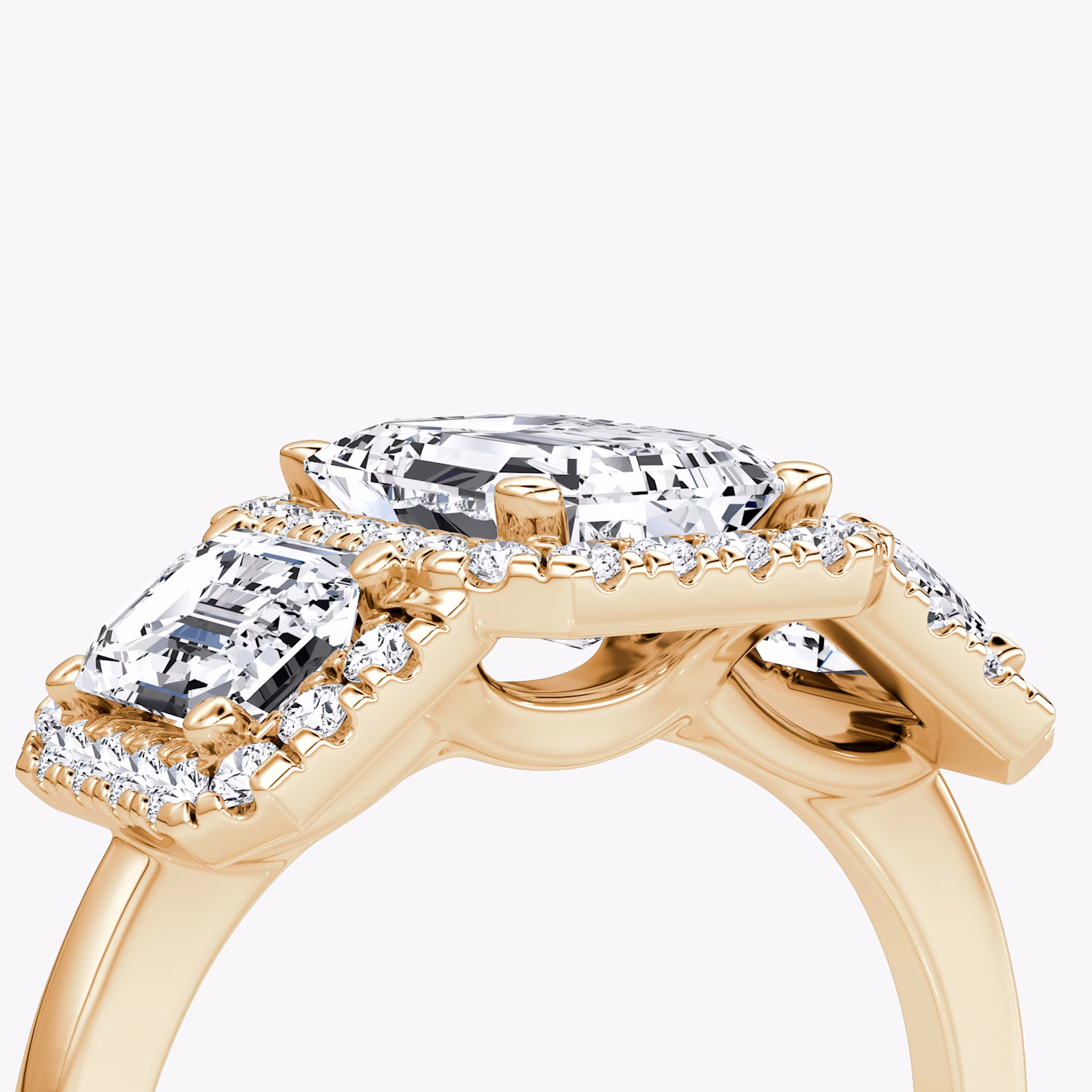 The Three Stone Halo | Emerald | 14k | Rose Gold | bandAccent: Plain | sideStoneCarat: 0.50ct | diamondOrientation: vertical | caratWeight: other