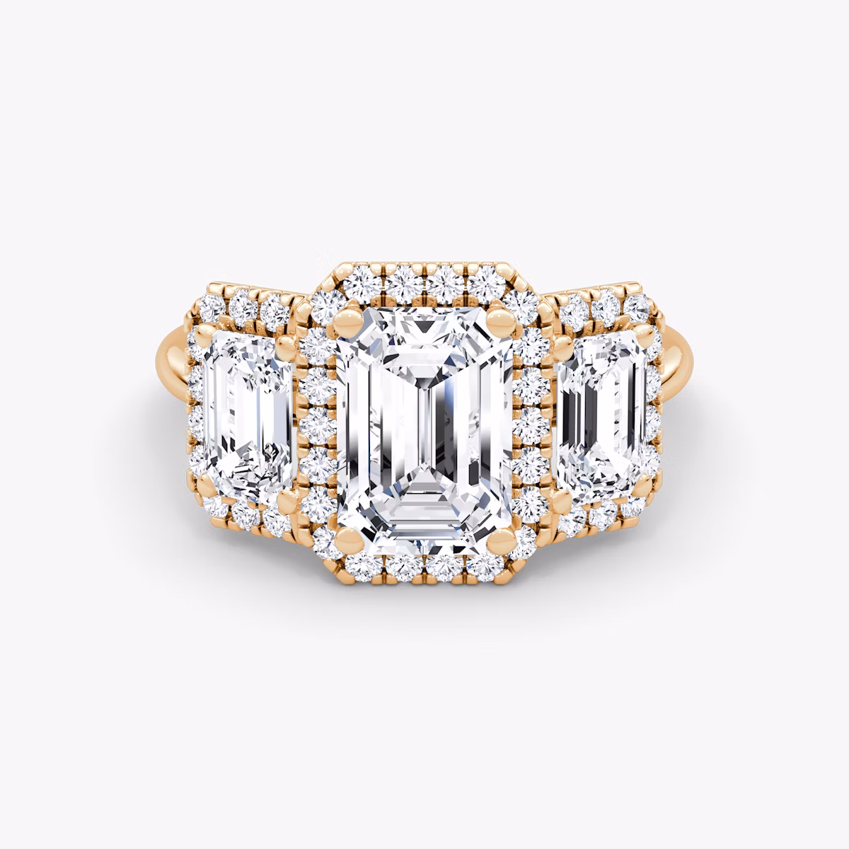 The Three Stone Halo | Emerald | 14k | Rose Gold | bandAccent: Plain | sideStoneCarat: 0.50ct | diamondOrientation: vertical | caratWeight: other