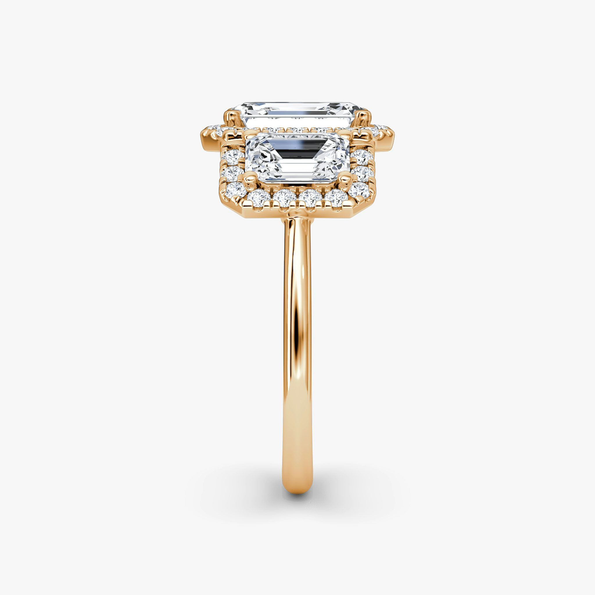 The Three Stone Halo | Emerald | 14k | Rose Gold | bandAccent: Plain | sideStoneCarat: 0.50ct | diamondOrientation: vertical | caratWeight: other