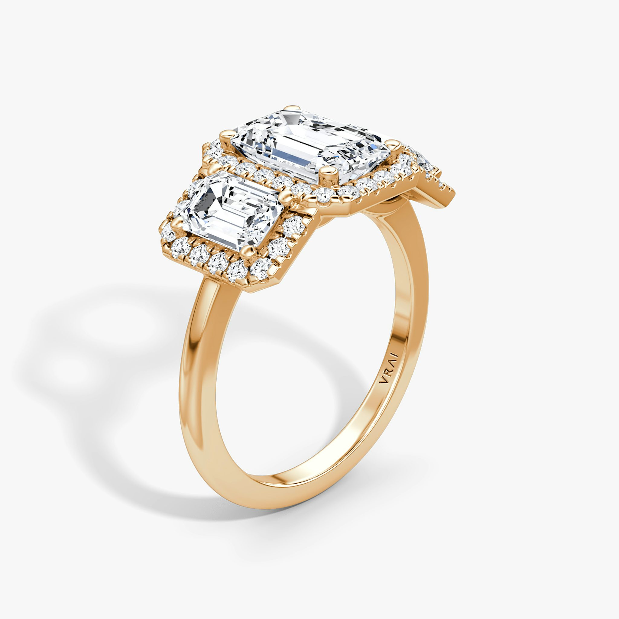 The Three Stone Halo | Emerald | 14k | Rose Gold | bandAccent: Plain | sideStoneCarat: 0.50ct | diamondOrientation: vertical | caratWeight: other