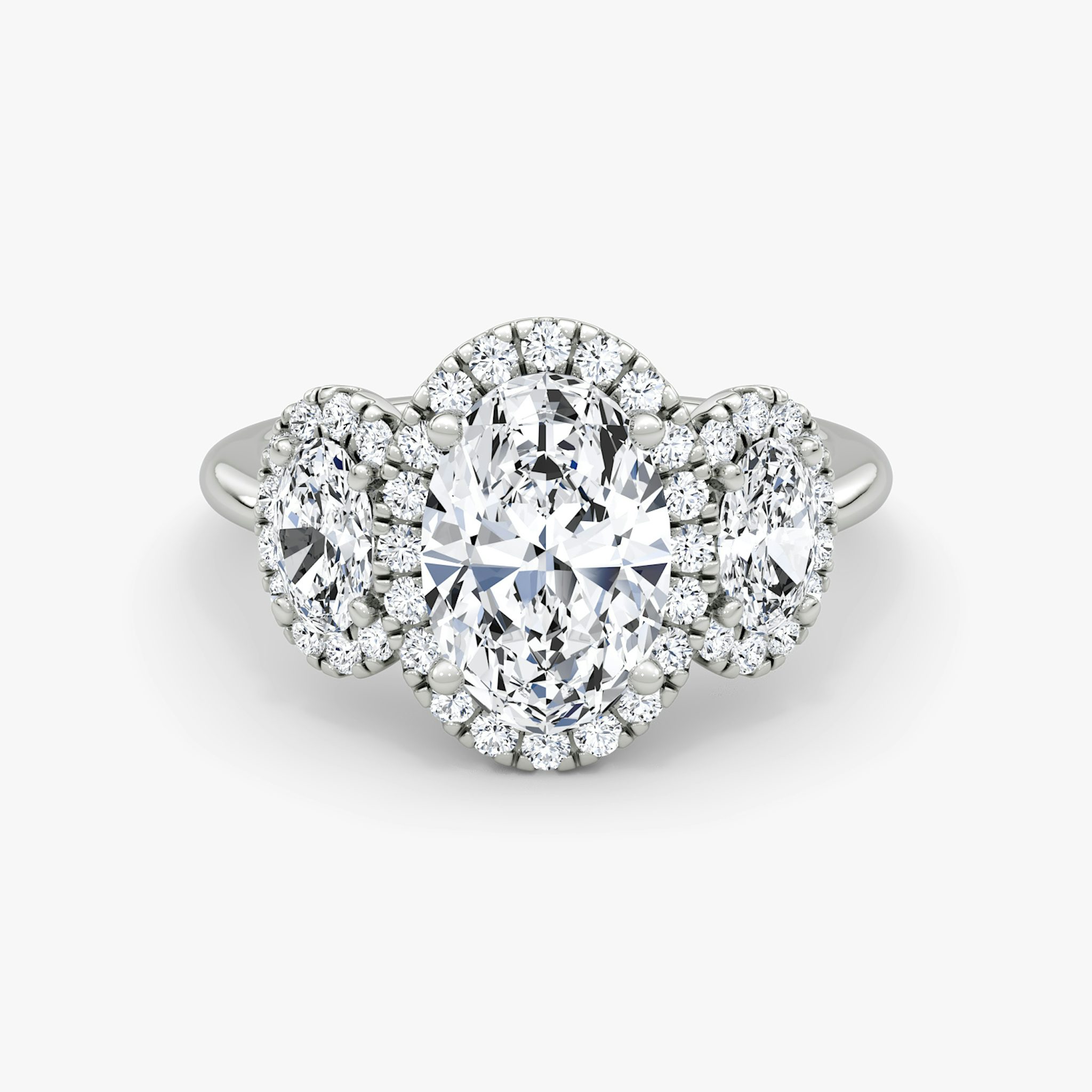 The Three Stone Halo | Oval | Platinum | bandAccent: Plain | sideStoneCarat: 0.25ct | diamondOrientation: vertical | caratWeight: other