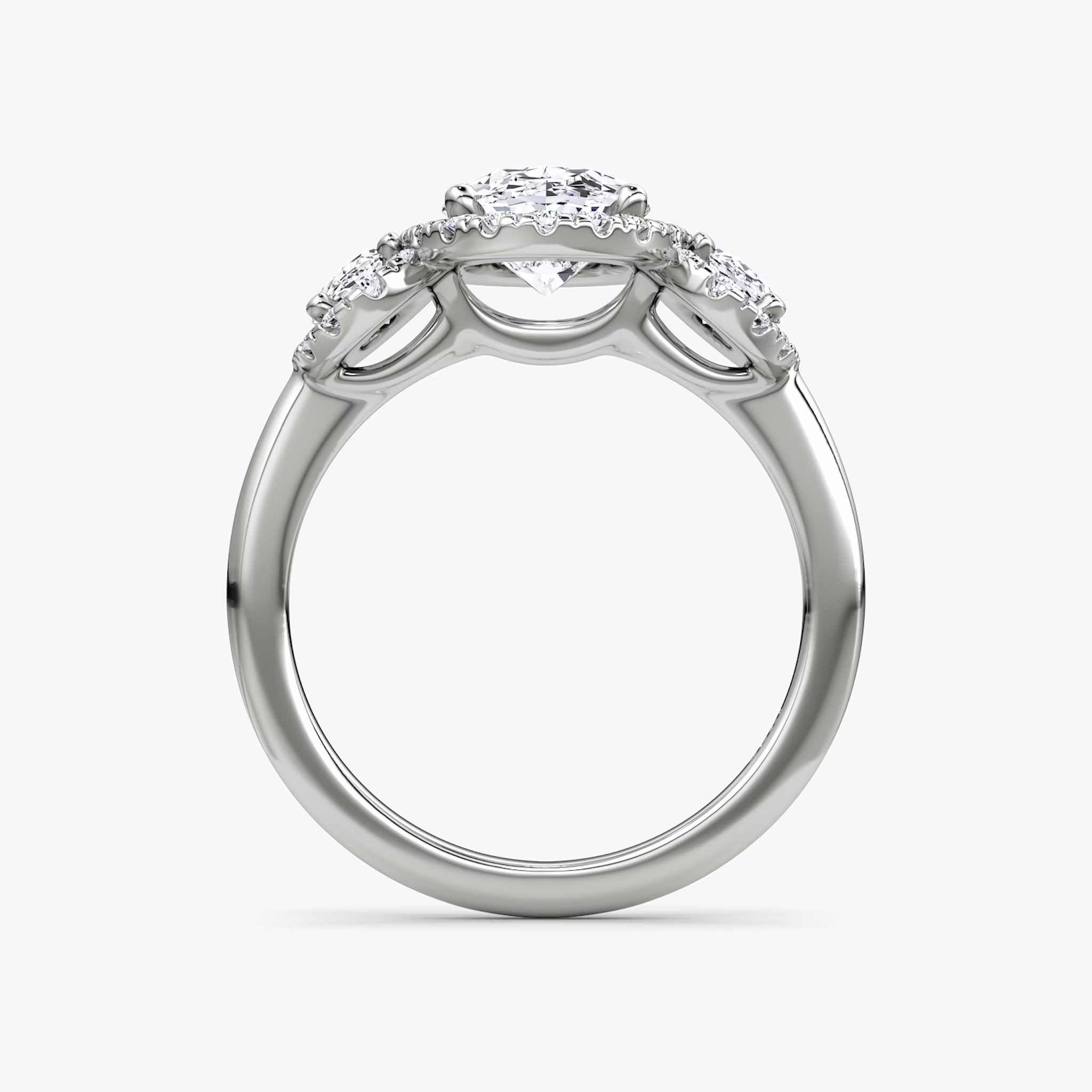 The Three Stone Halo | Oval | Platinum | bandAccent: Plain | sideStoneCarat: 0.25ct | diamondOrientation: vertical | caratWeight: other