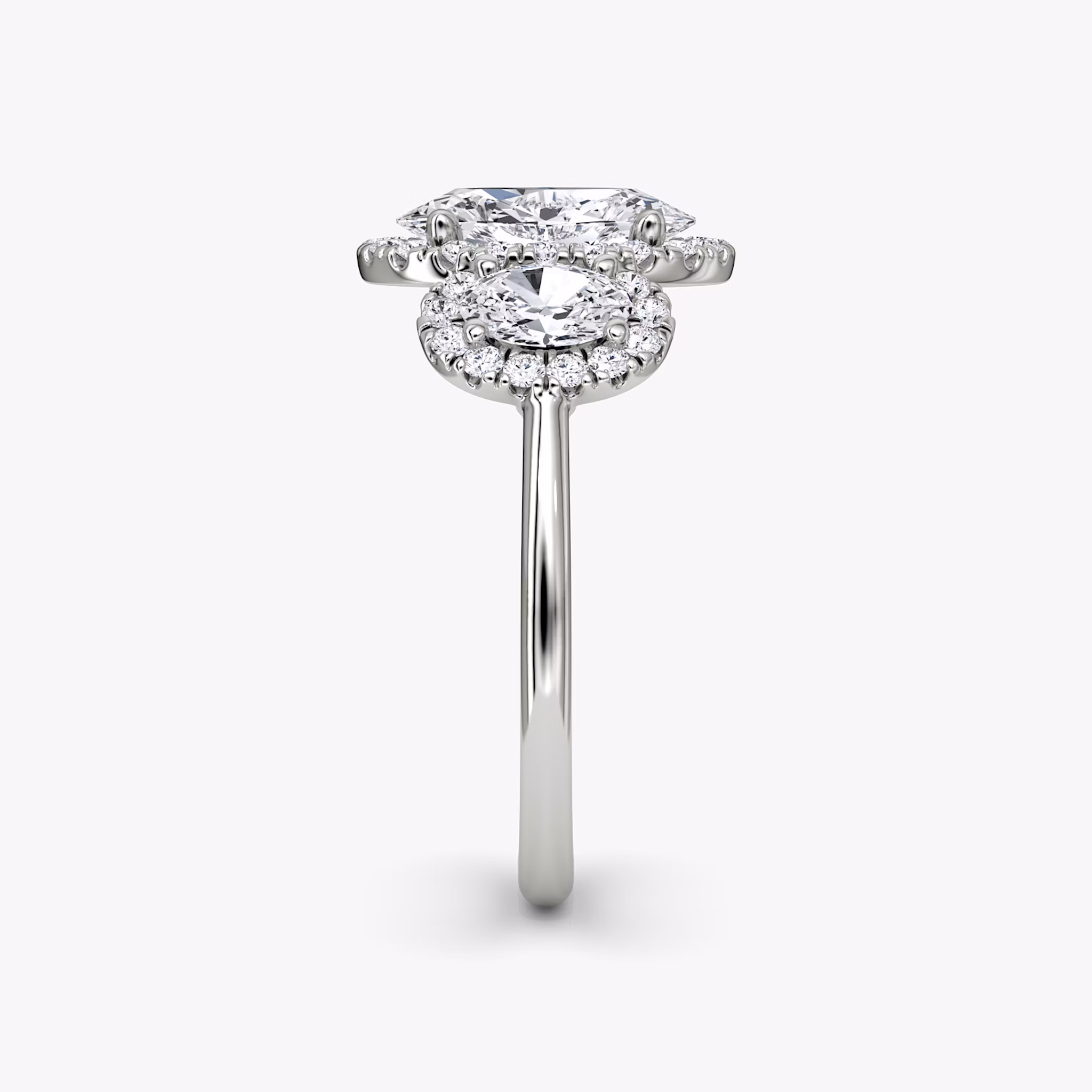 The Three Stone Halo | Oval | Platinum | bandAccent: Plain | sideStoneCarat: 0.25ct | diamondOrientation: vertical | caratWeight: other