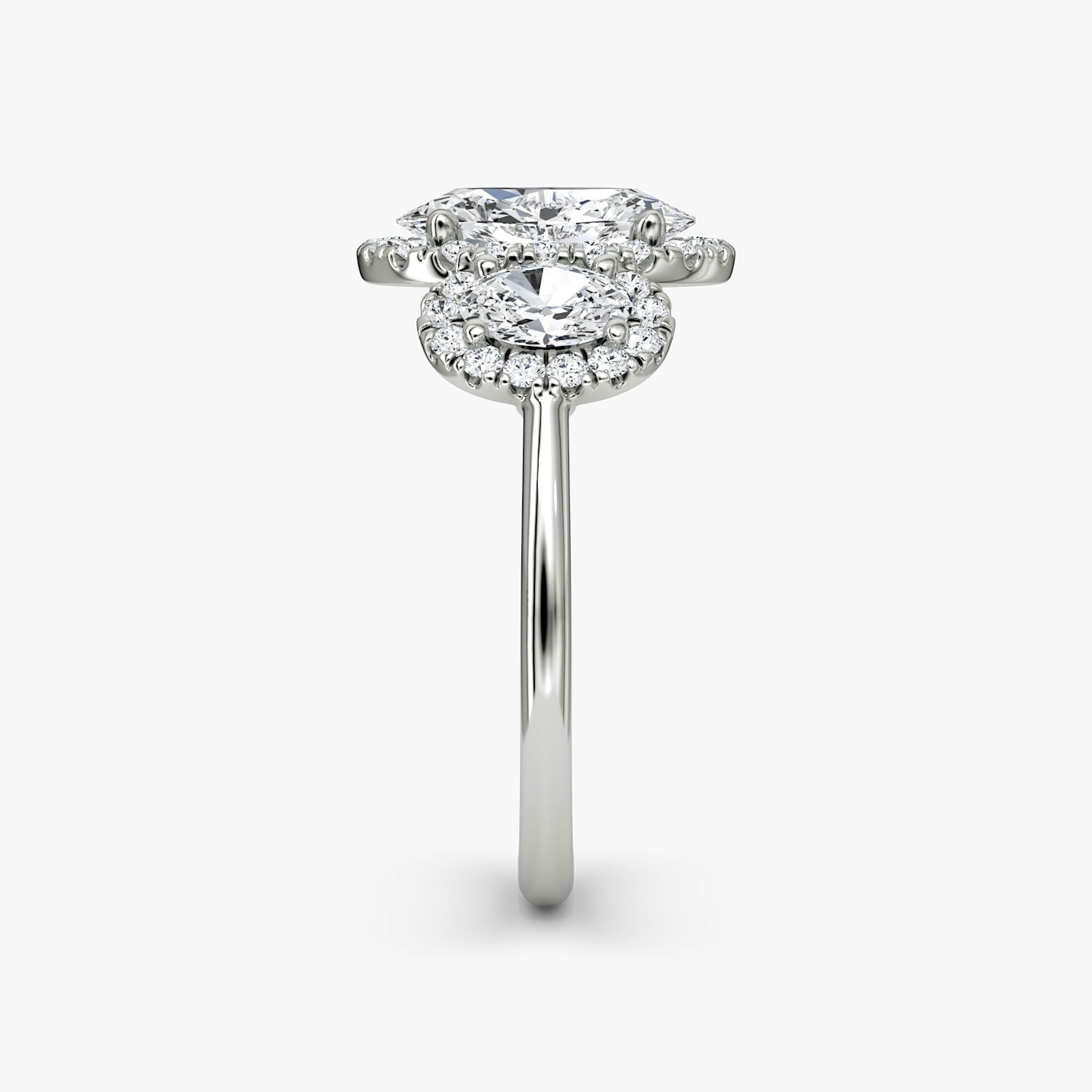 The Three Stone Halo | Oval | Platinum | bandAccent: Plain | sideStoneCarat: 0.25ct | diamondOrientation: vertical | caratWeight: other