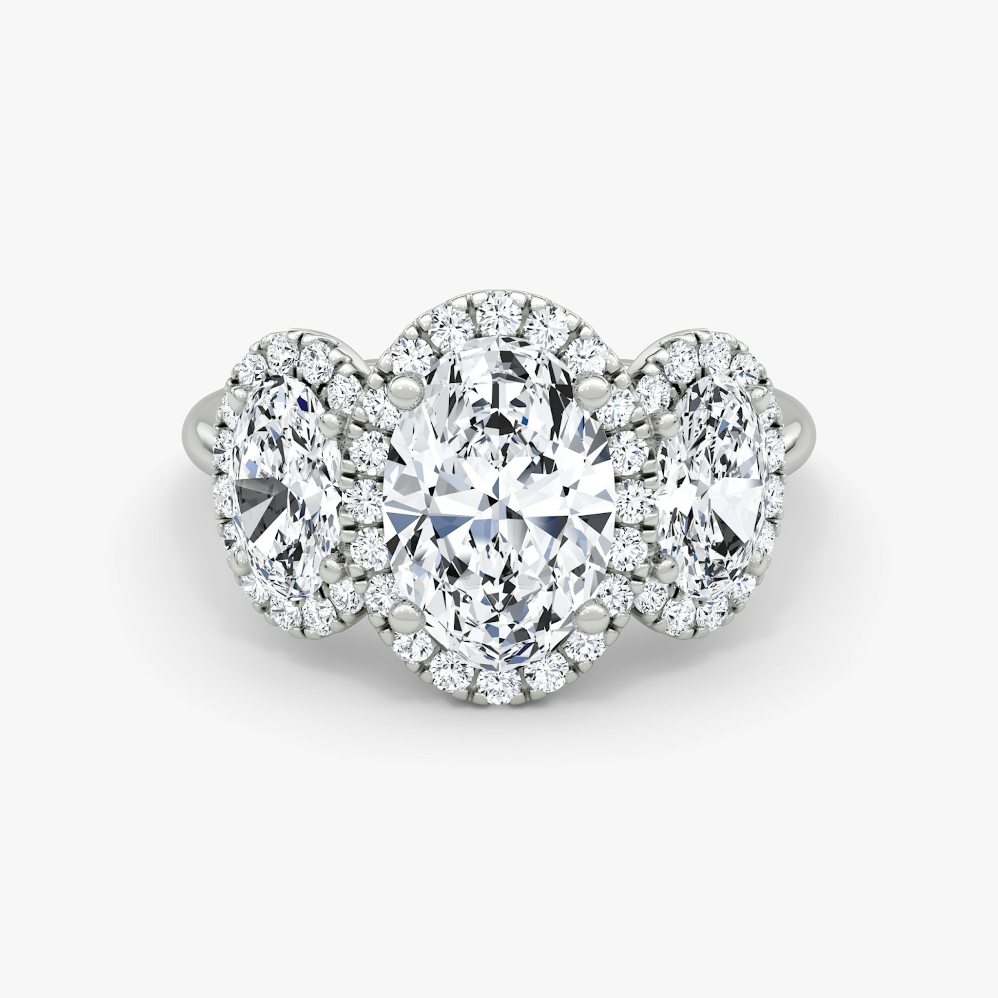 The Three Stone Halo | Oval | Platinum | bandAccent: Plain | sideStoneCarat: 0.50ct | diamondOrientation: vertical | caratWeight: other