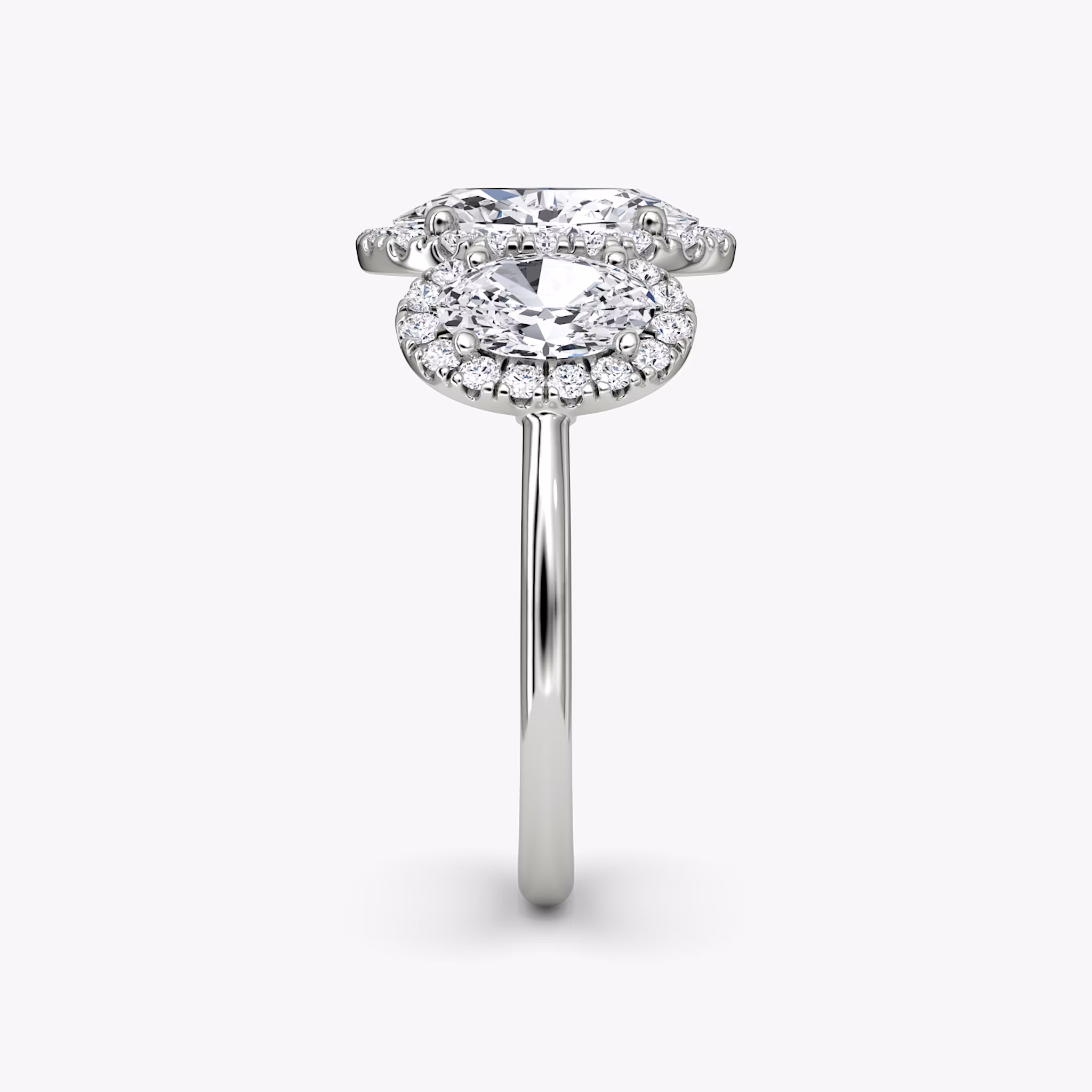 The Three Stone Halo | Oval | Platinum | bandAccent: Plain | sideStoneCarat: 0.50ct | diamondOrientation: vertical | caratWeight: other