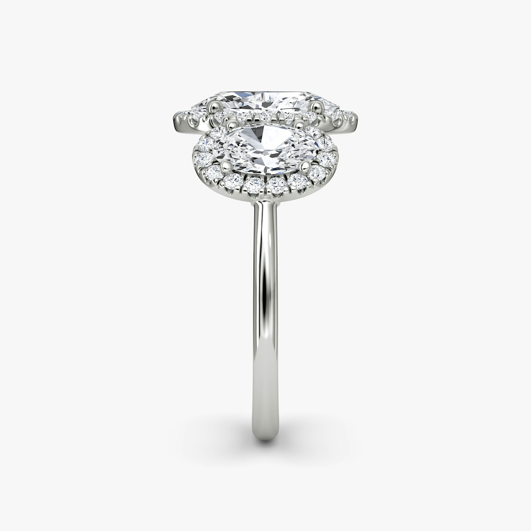 The Three Stone Halo | Oval | Platinum | bandAccent: Plain | sideStoneCarat: 0.50ct | diamondOrientation: vertical | caratWeight: other