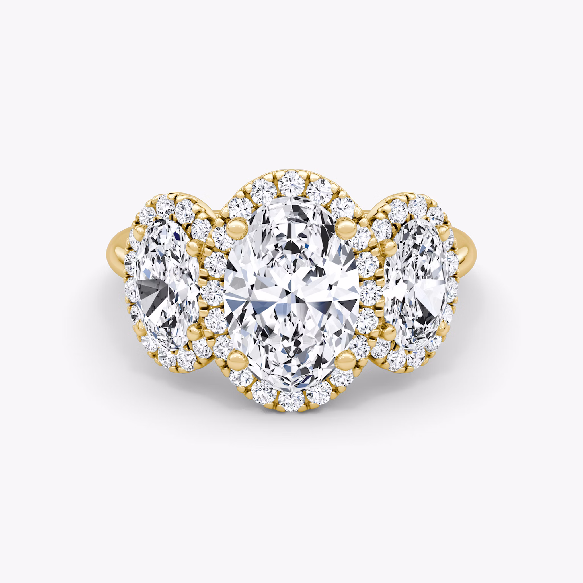 The Three Stone Halo | Oval | 18k | Yellow Gold | bandAccent: Plain | sideStoneCarat: 0.50ct | diamondOrientation: vertical | caratWeight: other