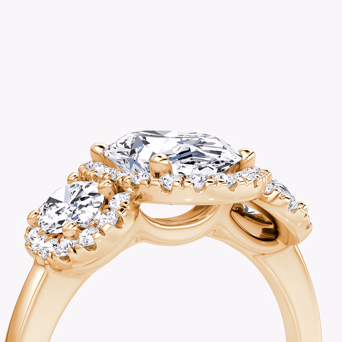 The Three Stone Halo | Oval | 14k | Rose Gold | bandAccent: Plain | sideStoneCarat: 0.25ct | diamondOrientation: vertical | caratWeight: other