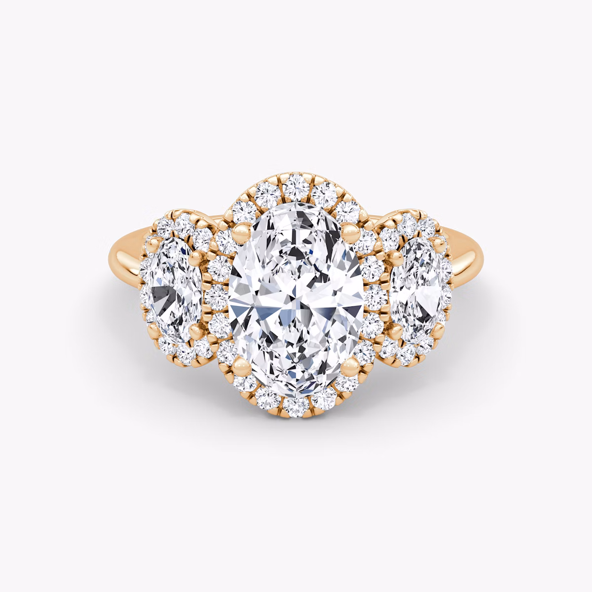 The Three Stone Halo | Oval | 14k | Rose Gold | bandAccent: Plain | sideStoneCarat: 0.25ct | diamondOrientation: vertical | caratWeight: other