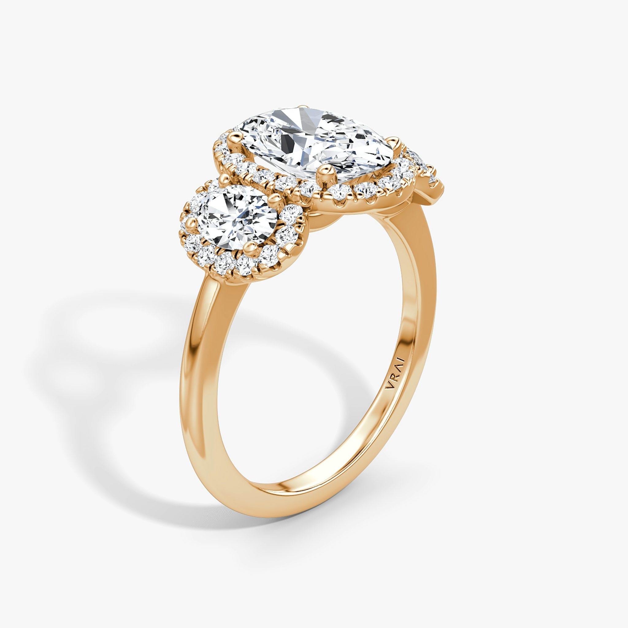 The Three Stone Halo | Oval | 14k | Rose Gold | bandAccent: Plain | sideStoneCarat: 0.25ct | diamondOrientation: vertical | caratWeight: other