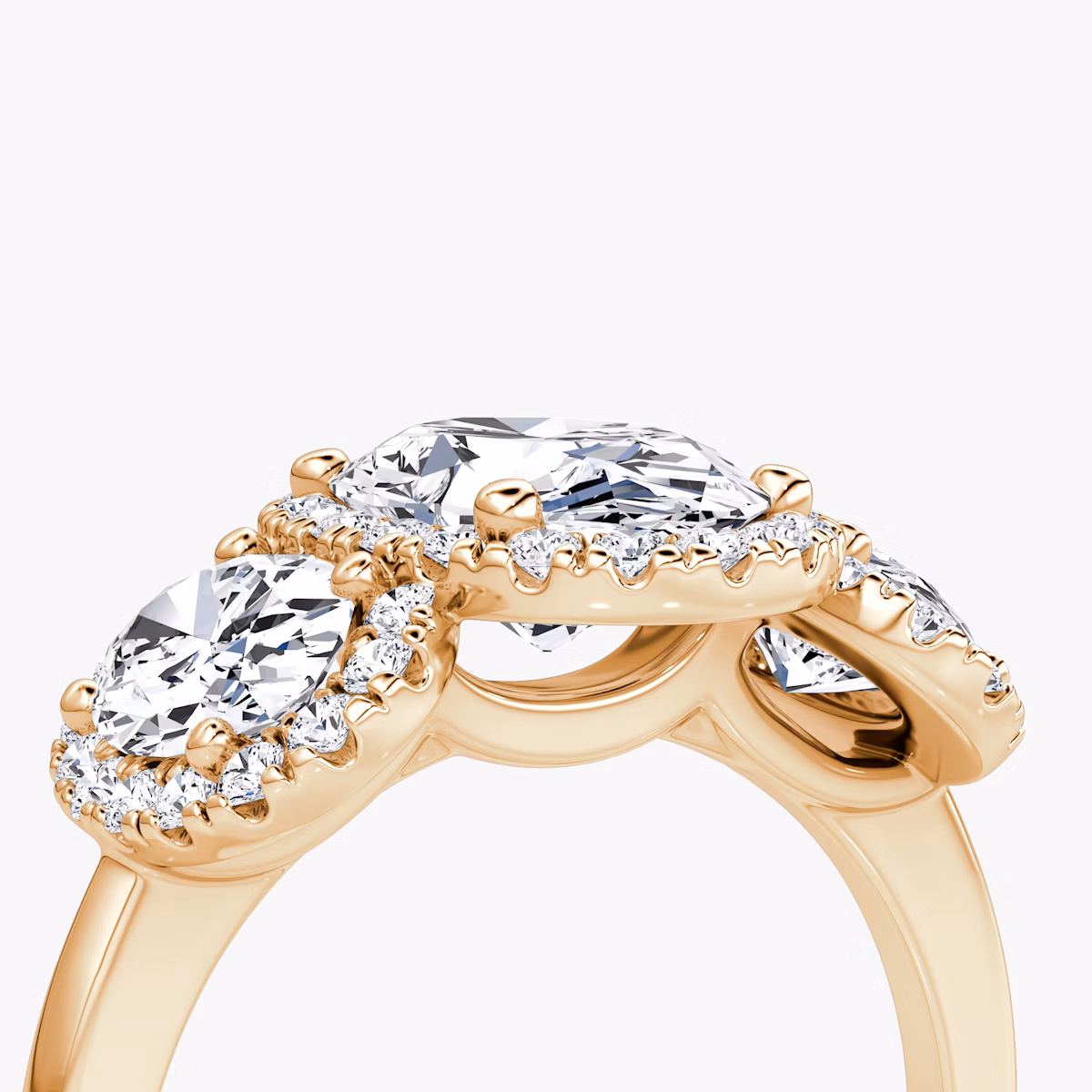 The Three Stone Halo | Oval | 14k | Rose Gold | bandAccent: Plain | sideStoneCarat: 0.50ct | diamondOrientation: vertical | caratWeight: other