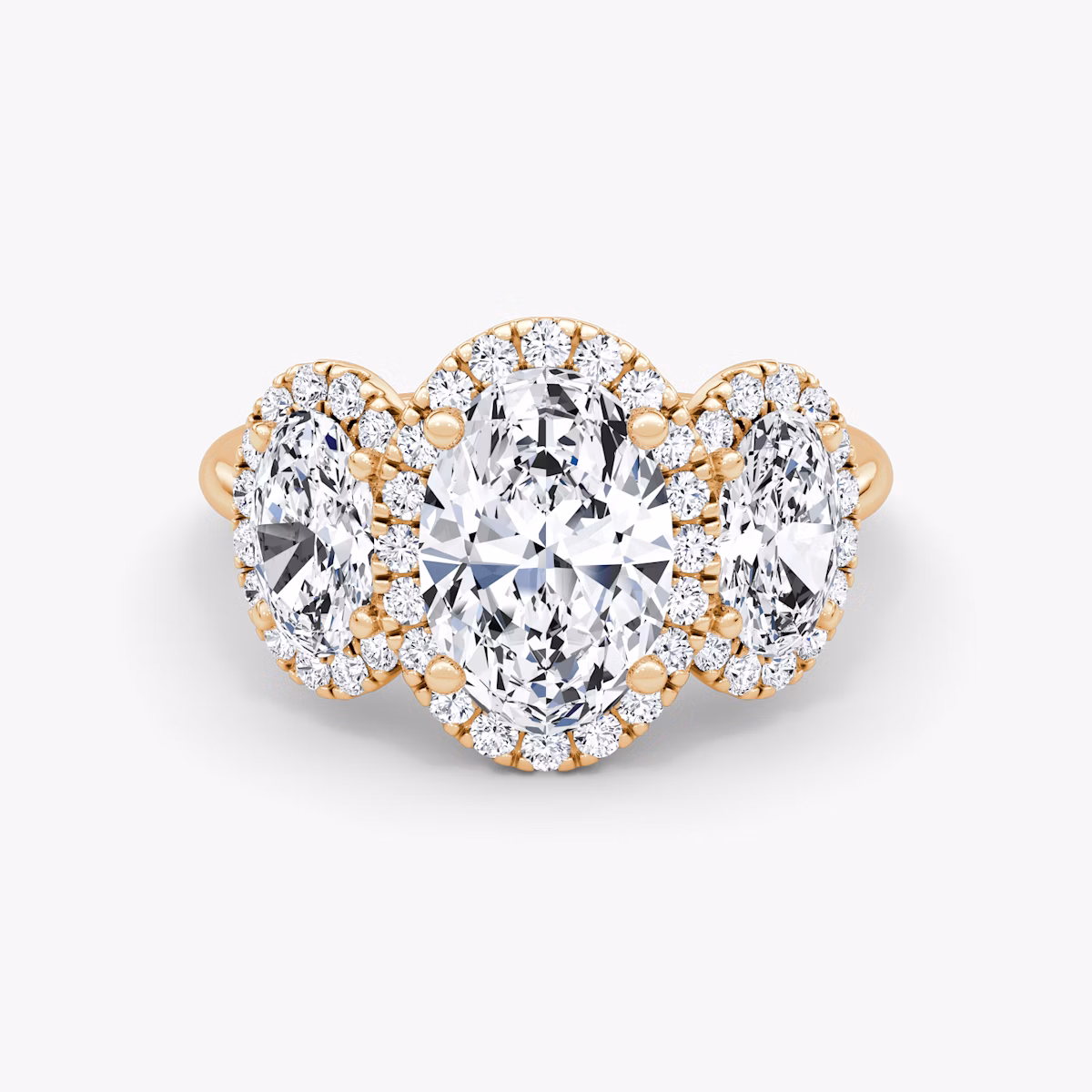 The Three Stone Halo | Oval | 14k | Rose Gold | bandAccent: Plain | sideStoneCarat: 0.50ct | diamondOrientation: vertical | caratWeight: other