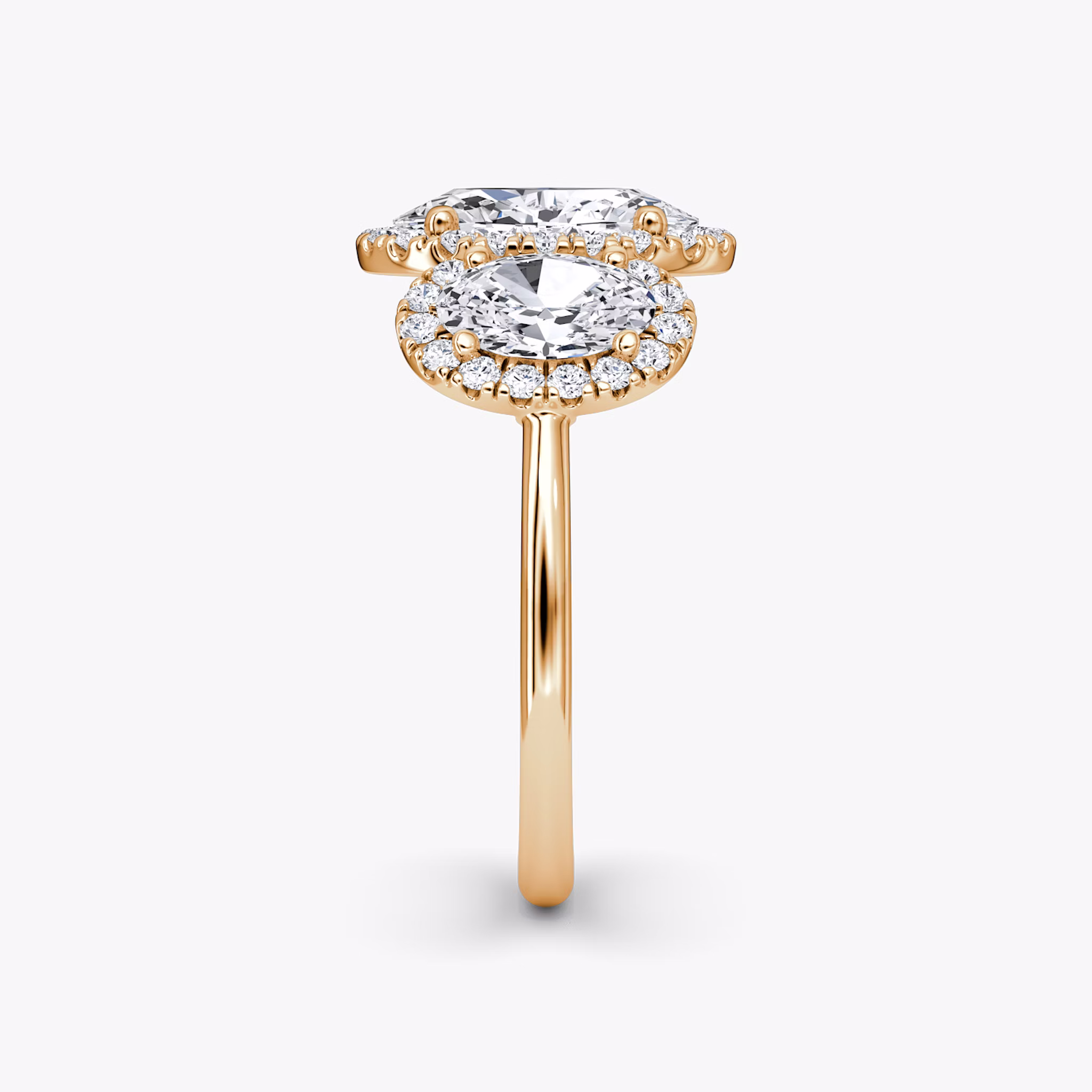 The Three Stone Halo | Oval | 14k | Rose Gold | bandAccent: Plain | sideStoneCarat: 0.50ct | diamondOrientation: vertical | caratWeight: other