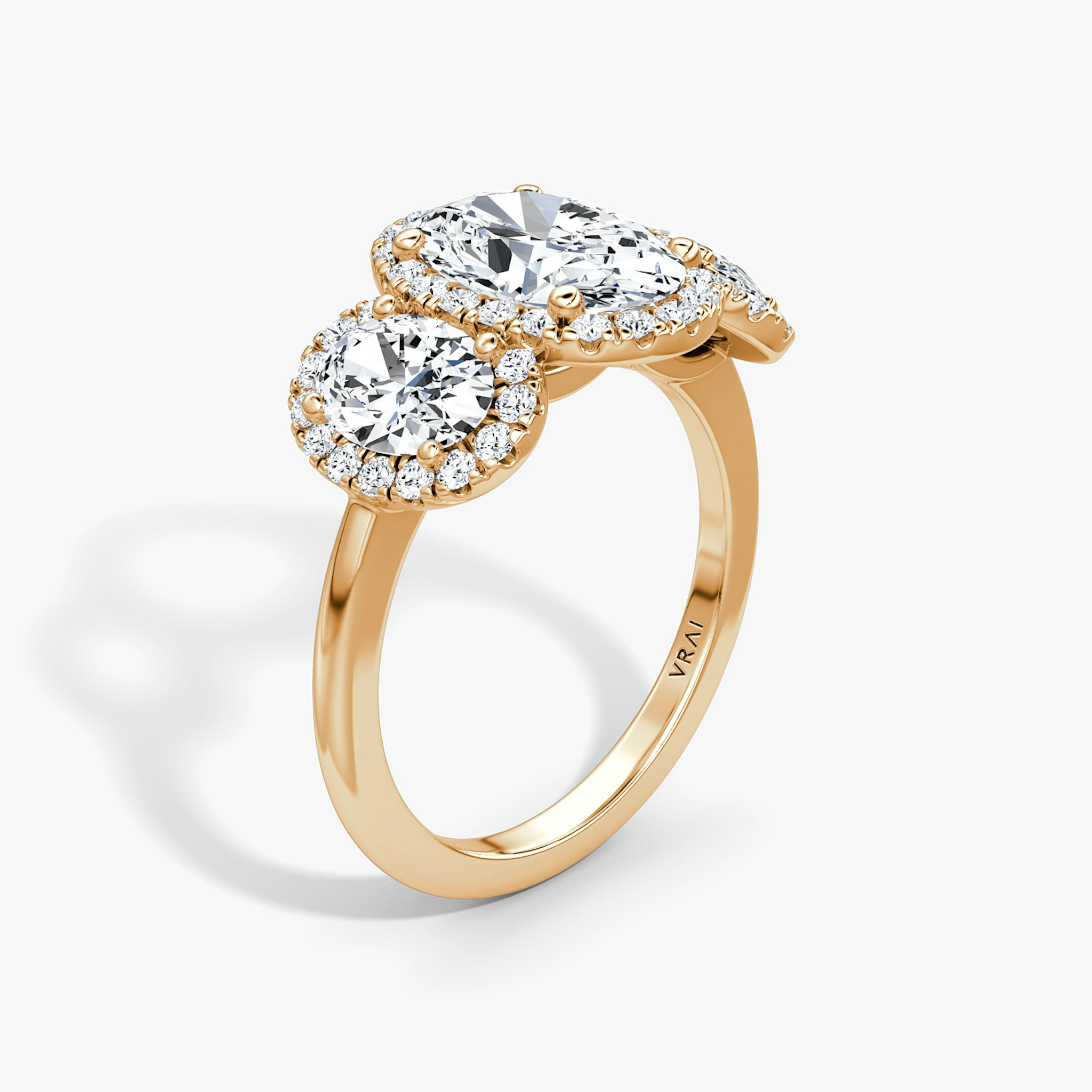 The Three Stone Halo | Oval | 14k | Rose Gold | bandAccent: Plain | sideStoneCarat: 0.50ct | diamondOrientation: vertical | caratWeight: other
