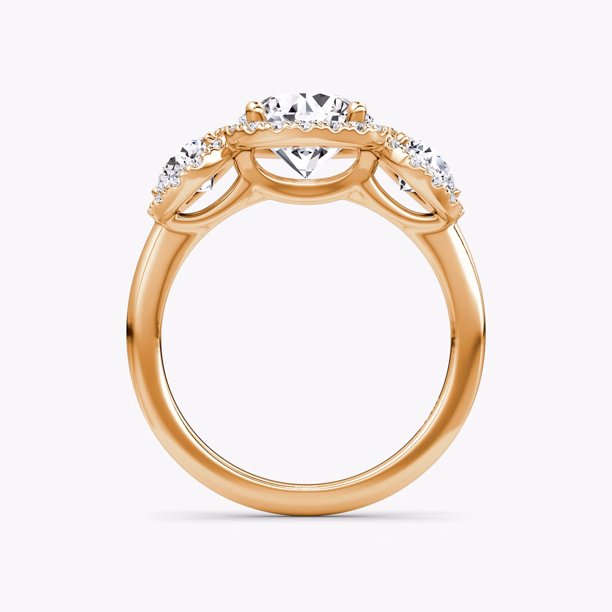 The Three Stone Halo | Round Brilliant | 14k | Rose Gold | bandAccent: Plain | caratWeight: other | sideStoneCarat: 0.25ct | diamondOrientation: vertical