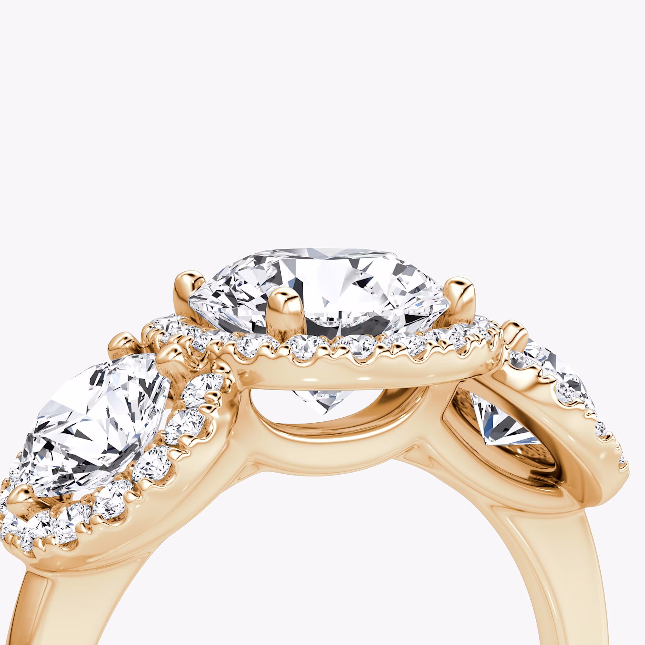 The Three Stone Halo | Round Brilliant | 14k | Rose Gold | bandAccent: Plain | caratWeight: other | sideStoneCarat: 0.50ct | diamondOrientation: vertical