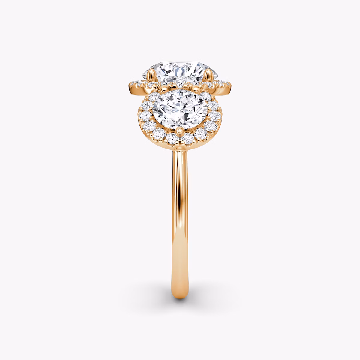 The Three Stone Halo | Round Brilliant | 14k | Rose Gold | bandAccent: Plain | caratWeight: other | sideStoneCarat: 0.50ct | diamondOrientation: vertical
