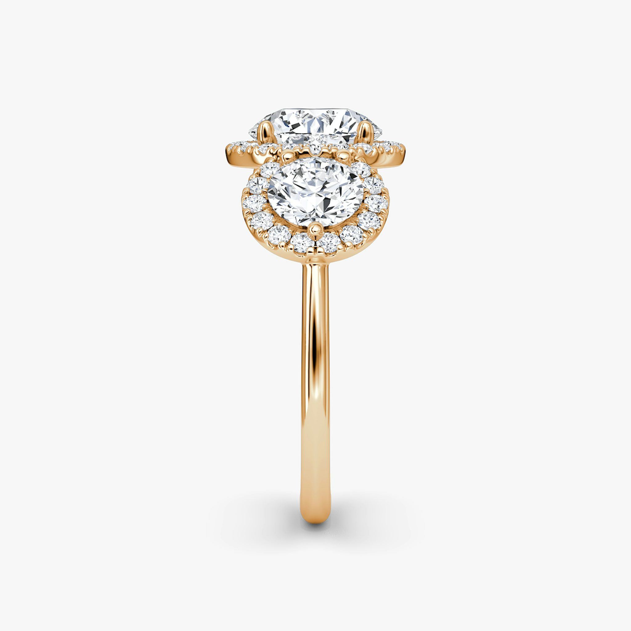 The Three Stone Halo | Round Brilliant | 14k | Rose Gold | bandAccent: Plain | caratWeight: other | sideStoneCarat: 0.50ct | diamondOrientation: vertical