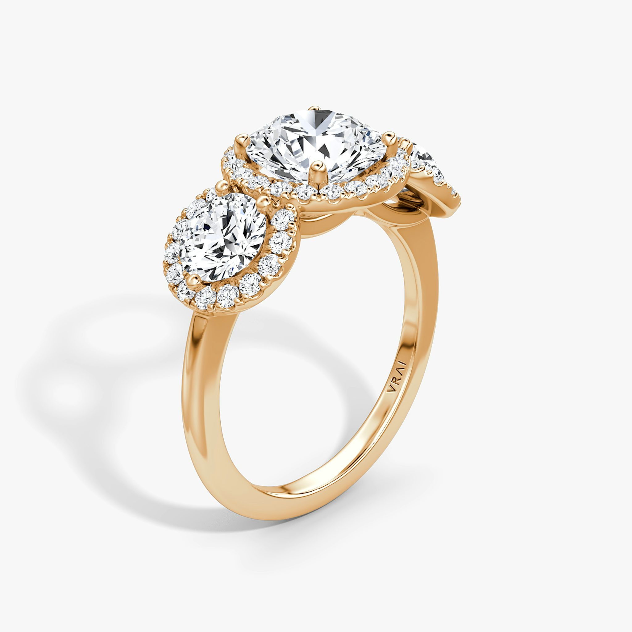 The Three Stone Halo | Round Brilliant | 14k | Rose Gold | bandAccent: Plain | caratWeight: other | sideStoneCarat: 0.50ct | diamondOrientation: vertical