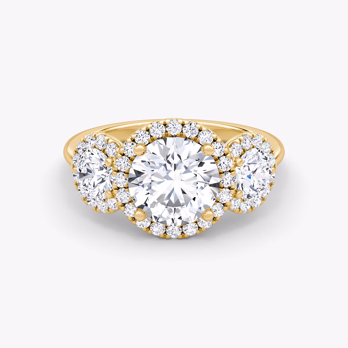 The Three Stone Halo | Round Brilliant | 18k | Yellow Gold | bandAccent: Plain | caratWeight: 1.0ct | sideStoneCarat: 0.25ct | diamondOrientation: vertical