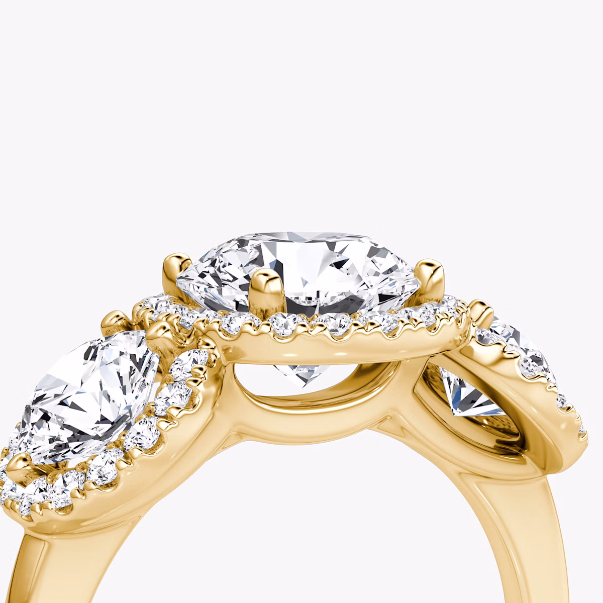 The Three Stone Halo | Round Brilliant | 18k | Yellow Gold | bandAccent: Plain | caratWeight: other | sideStoneCarat: 0.50ct | diamondOrientation: vertical