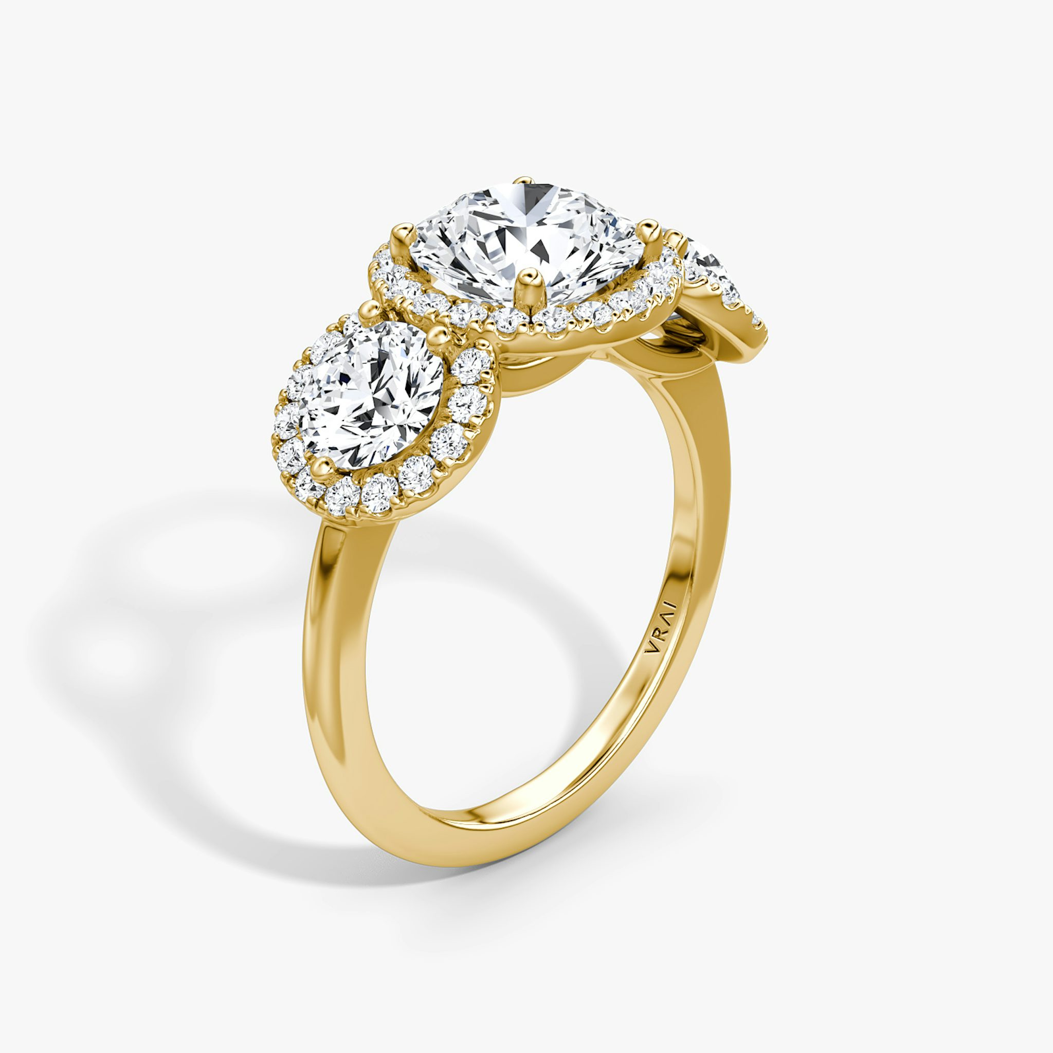 The Three Stone Halo | Round Brilliant | 18k | Yellow Gold | bandAccent: Plain | caratWeight: 2.0ct | sideStoneCarat: 0.50ct | diamondOrientation: vertical