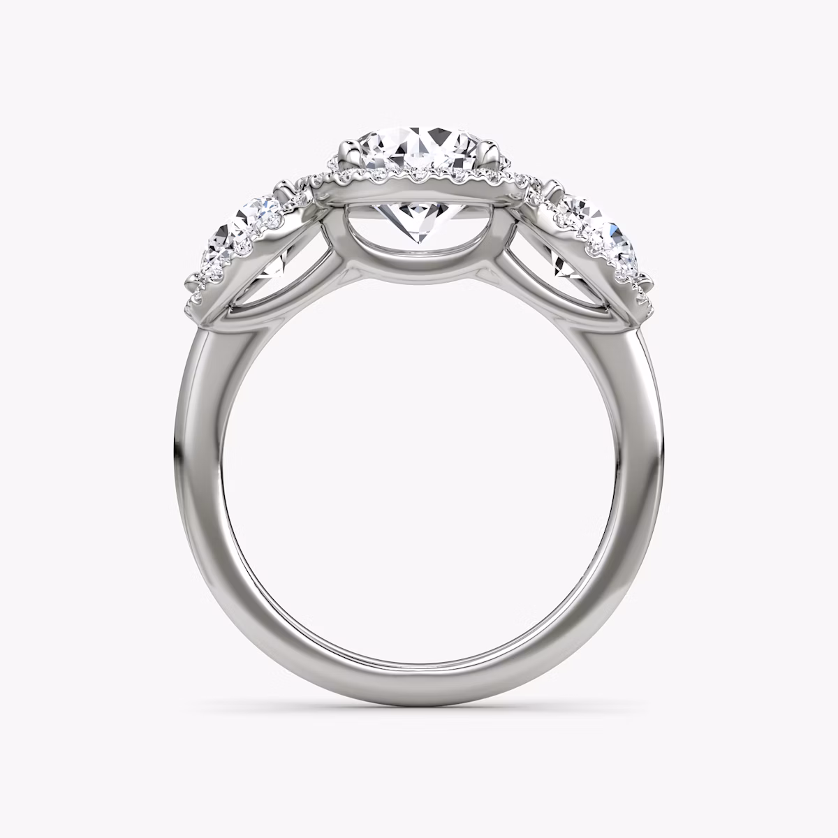 The Three Stone Halo | Round Brilliant | Platinum | bandAccent: Plain | caratWeight: 1.0ct | sideStoneCarat: 0.50ct | diamondOrientation: vertical