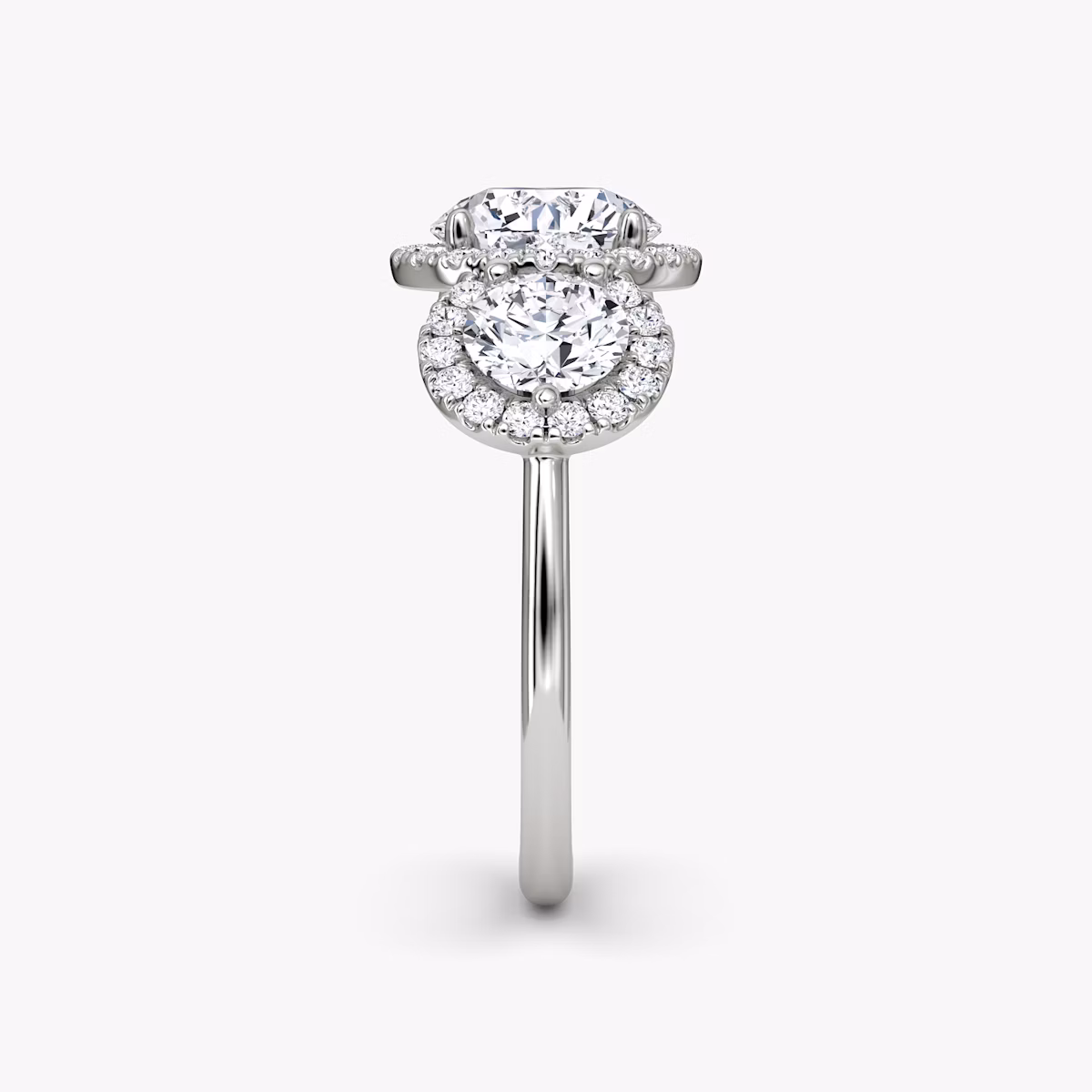 The Three Stone Halo | Round Brilliant | Platinum | bandAccent: Plain | caratWeight: 1.0ct | sideStoneCarat: 0.50ct | diamondOrientation: vertical