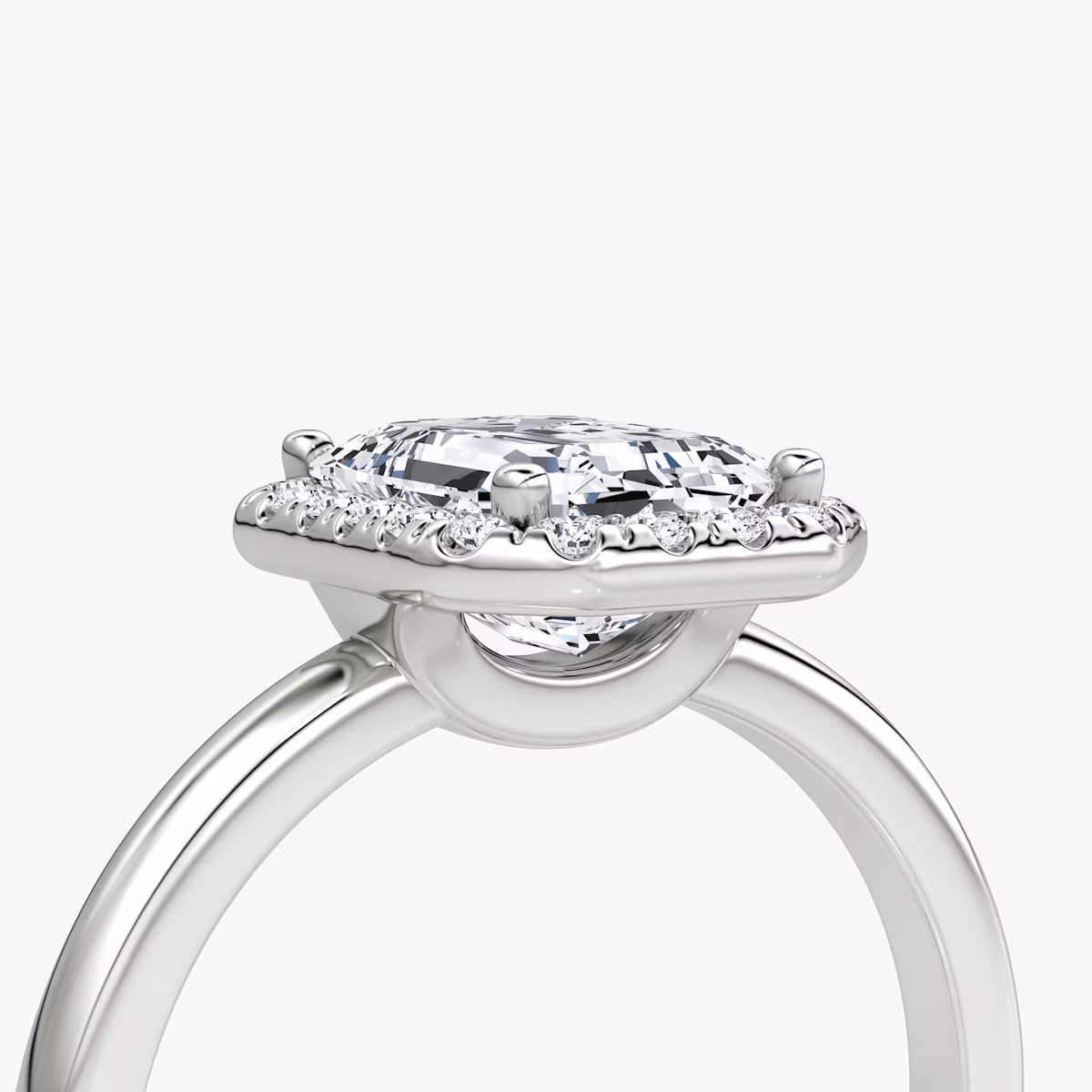 The Halo | Emerald | Platinum | bandAccent: Plain | haloSize: original | diamondOrientation: vertical | caratWeight: other