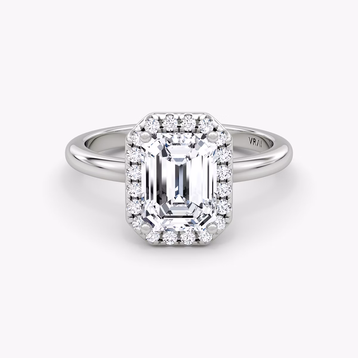 The Halo | Emerald | Platinum | bandAccent: Plain | haloSize: original | diamondOrientation: vertical | caratWeight: other